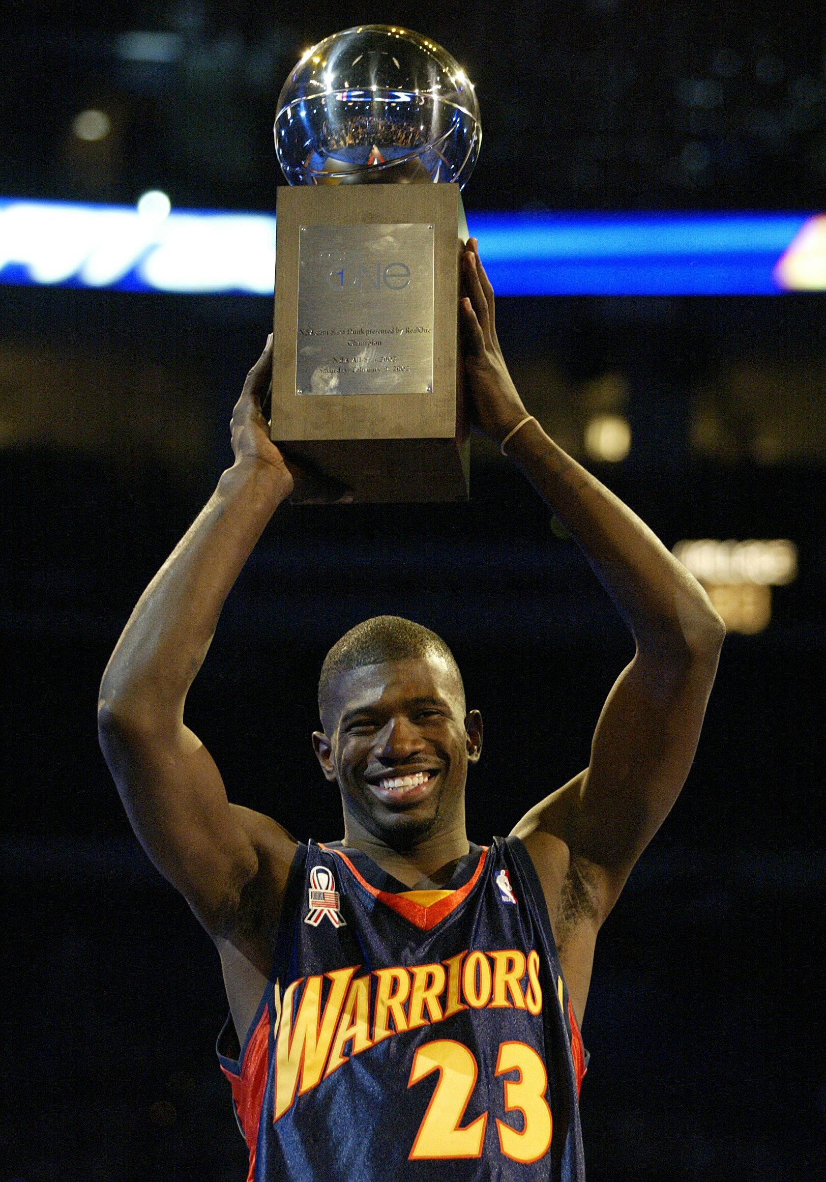 9 Feb 2002:  Jason Richardson of the Golden State Warriors holds the winner's trophy after winning the NBA.Com Slam Dunk competition during the NBA All-Star Weekend at the First Union Center in Philadelphia, Pennsylvania. Richardson won the event and the 