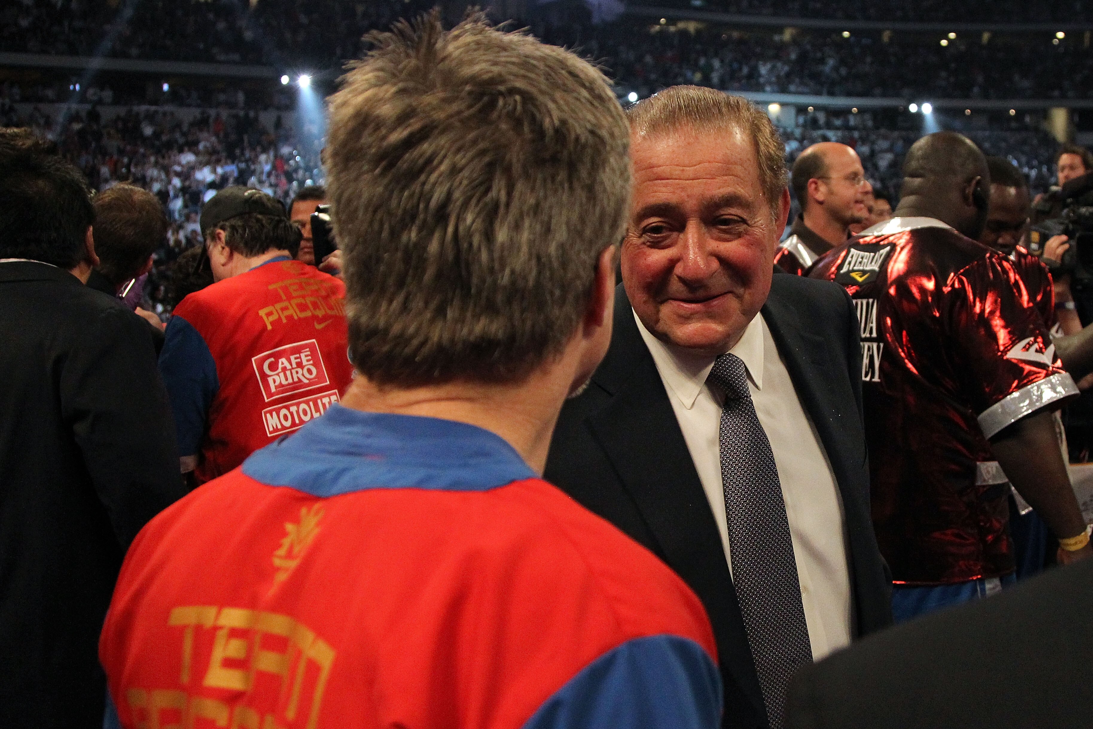 ARLINGTON, TX - MARCH 13:  (R-L) Promoter Bob Arum talks with trainer Freddie Roach, who trains Manny Pacquiao of the Philippines, in the ring after Pacquiao defeated Joshua Clottey of Ghana during the WBO welterweight title fight at Cowboys Stadium on Ma