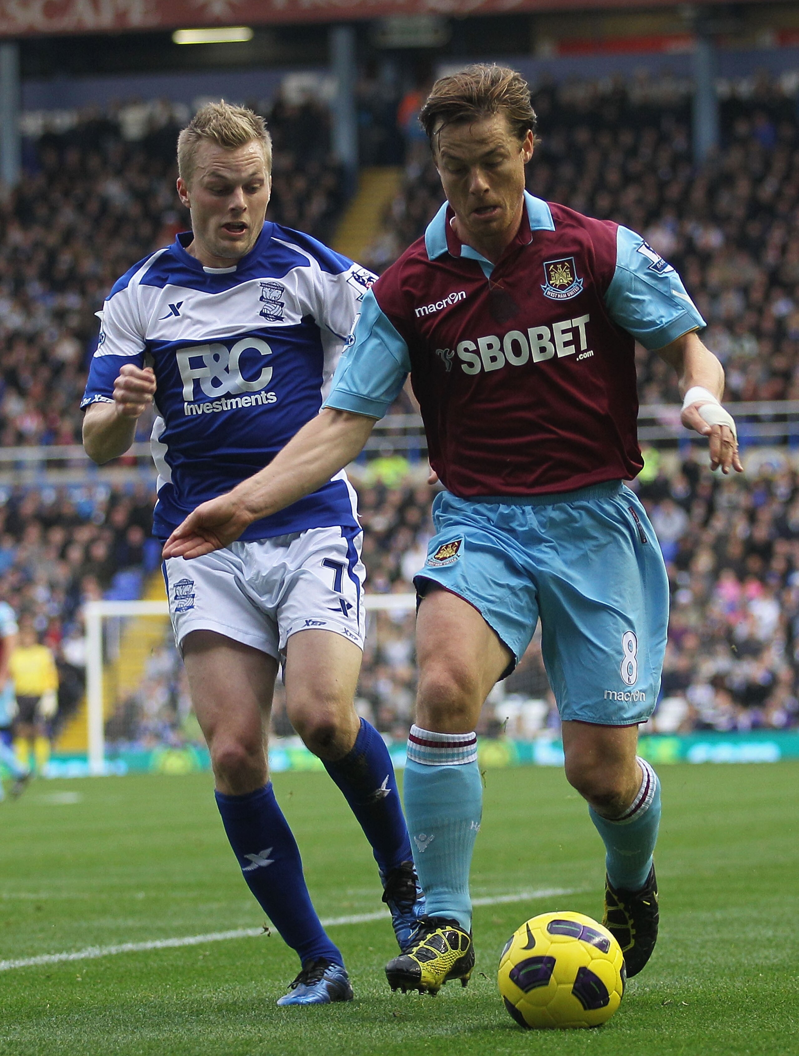 BIRMINGHAM, ENGLAND - NOVEMBER 06:  Scott Parker (R) of West Ham contests with Sebastian Larsson of Birmingham during the Barclays Premier League match between Birmingham City and West Ham United at St Andrews on November 6, 2010 in Birmingham, England.  