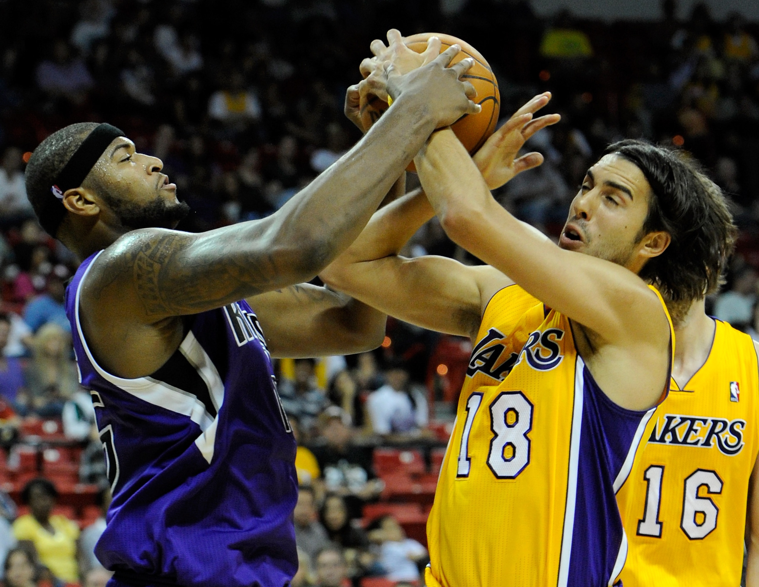 LAS VEGAS - OCTOBER 13: DeMarcus Cousins #15 of the Sacramento Kings and Sasha Vujacic #18 of the Los Angeles Lakers fight for a rebound during their preseason game at the Thomas & Mack Center October 13, 2010 in Las Vegas, Nevada. The Lakers won 98-95. LAS VEGAS - OCTOBER 13: DeMarcus Cousins #15 of the Sacramento Kings and Sasha Vujacic #18 of the Los Angeles Lakers fight for a rebound during their preseason game at the Thomas & Mack Center October 13, 2010 in Las Vegas, Nevada. The Lakers won 98-95.