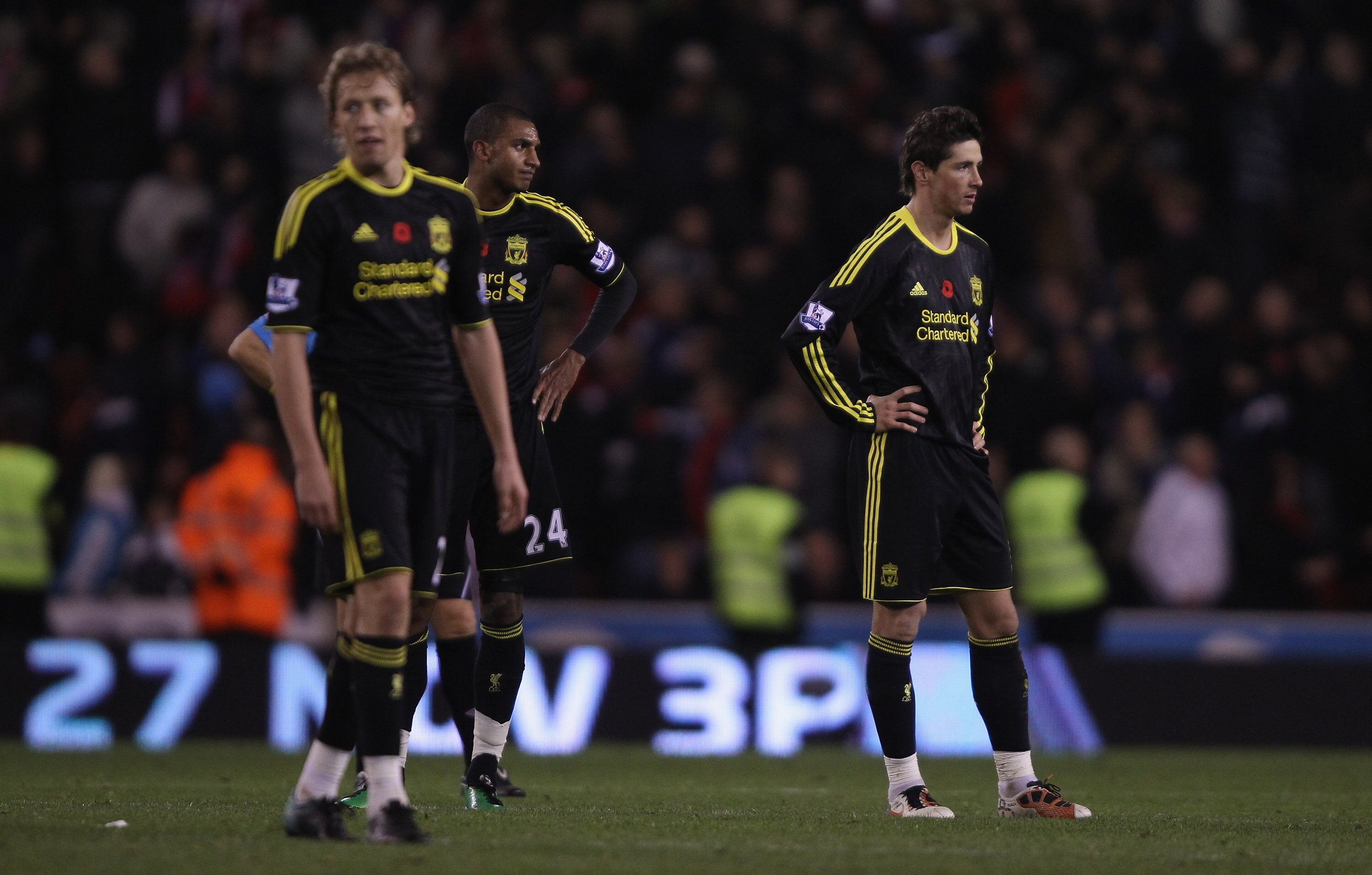 STOKE ON TRENT, ENGLAND - NOVEMBER 13: Fernando Torres,David Ngog and Lucas Leiva of Liverpool show their dejection after Stoke have scored the second goal during the Barclays Premier League match between Stoke City and Liverpool at Britannia Stadium on N