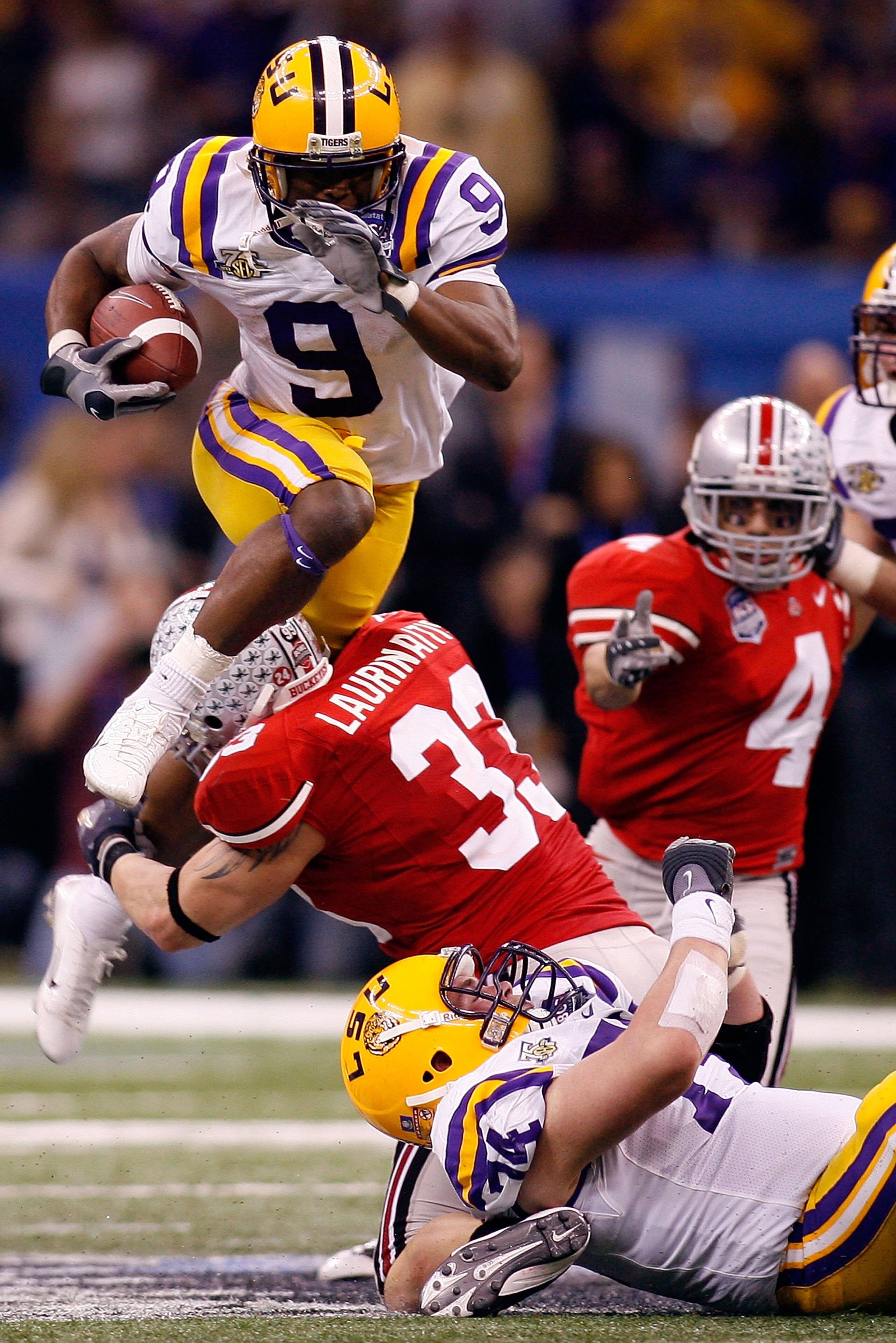 NEW ORLEANS - JANUARY 07: Early Doucet #9 of of the Louisiana State University Tigers runs with the ball against James Laurinaitis #33 of the Ohio State Buckeyes during the AllState BCS National Championship on January 7, 2008 at the Louisiana Superdome i