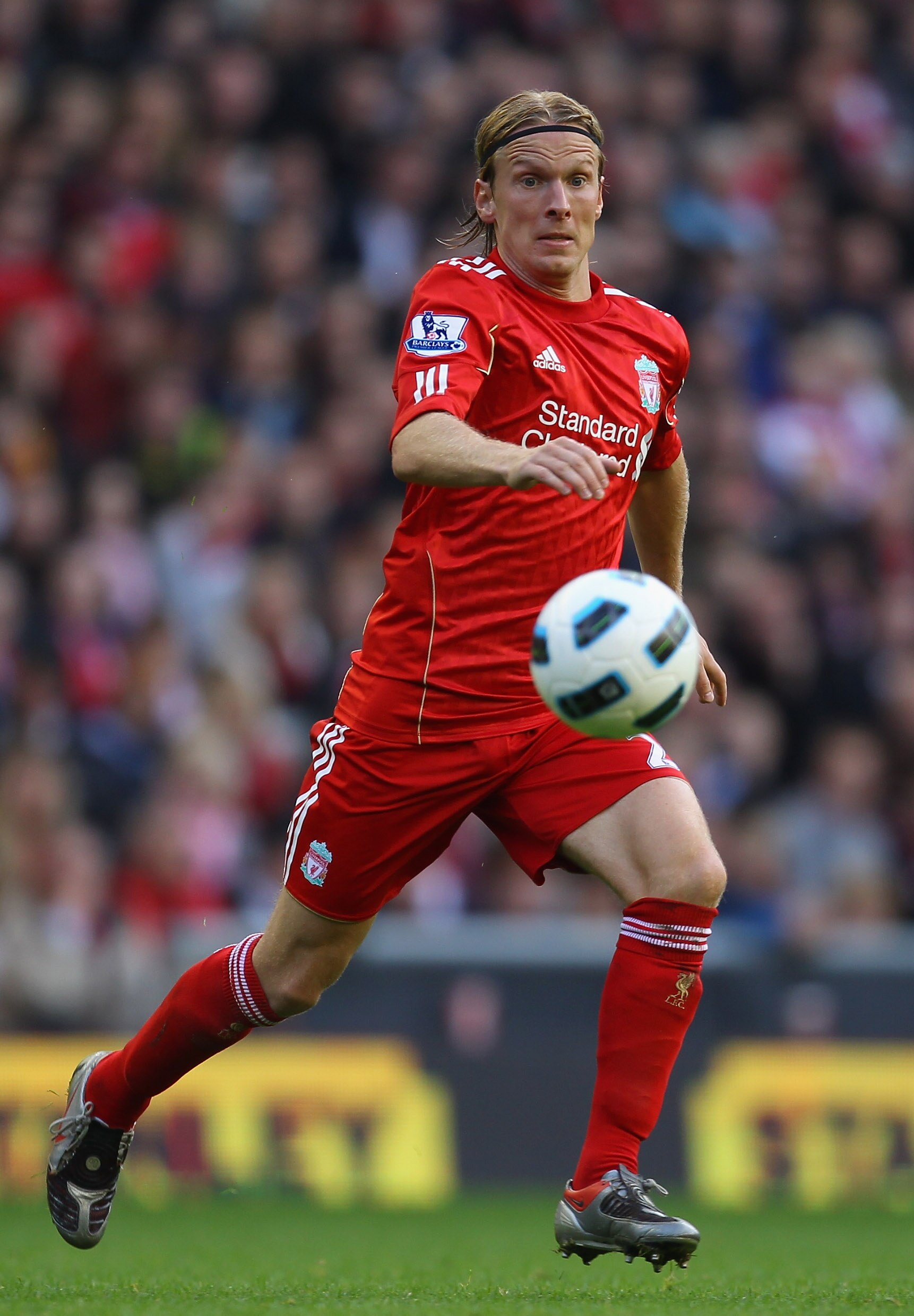 LIVERPOOL, ENGLAND - OCTOBER 03:  Christian Poulsen of Liverpool runs with the ball during the Barclays Premier League match between Liverpool and Blackpool at Anfield on October 3, 2010 in Liverpool, England.  (Photo by Alex Livesey/Getty Images)