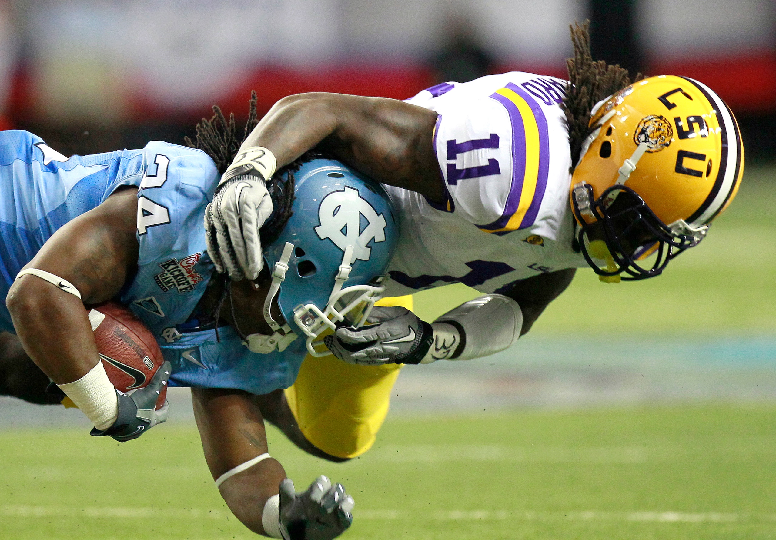 ATLANTA - SEPTEMBER 4: Kelvin Sheppard #11 of the LSU Tigers tackles Johnny White #34 of the North Carolina Tar Heels at the Georgia Dome September 4, 2010 in Atlanta, Georgia. (Photo by Kevin C. Cox/Getty Images) ATLANTA - SEPTEMBER 4: Kelvin Sheppard #11 of the LSU Tigers tackles Johnny White #34 of the North Carolina Tar Heels at the Georgia Dome September 4, 2010 in Atlanta, Georgia. (Photo by Kevin C. Cox/Getty Images)
