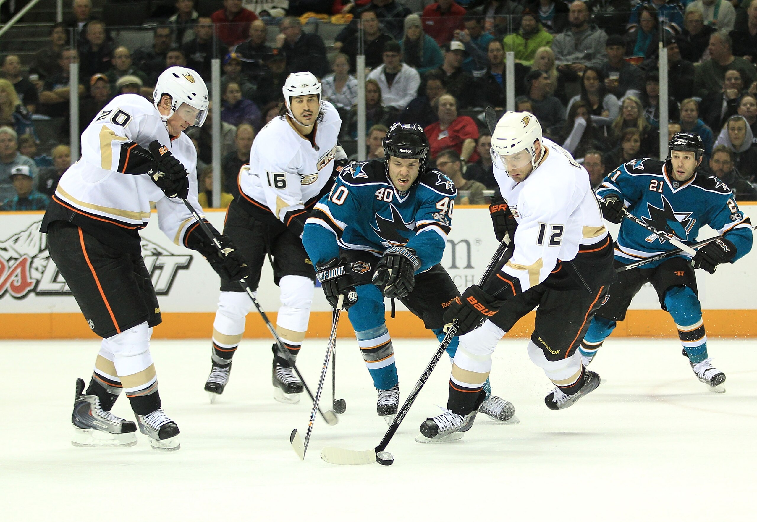 SAN JOSE, CA - NOVEMBER 09: Kent Huskins #40 of the San Jose Sharks is surrounded by Josh Green #12, Ryan Carter #20 and George Parros #16 of the Anaheim Ducks defense at HP Pavilion on November 9, 2010 in San Jose, California. (Photo by Ezra Shaw/Getty SAN JOSE, CA - NOVEMBER 09: Kent Huskins #40 of the San Jose Sharks is surrounded by Josh Green #12, Ryan Carter #20 and George Parros #16 of the Anaheim Ducks defense at HP Pavilion on November 9, 2010 in San Jose, California. (Photo by Ezra Shaw/Getty