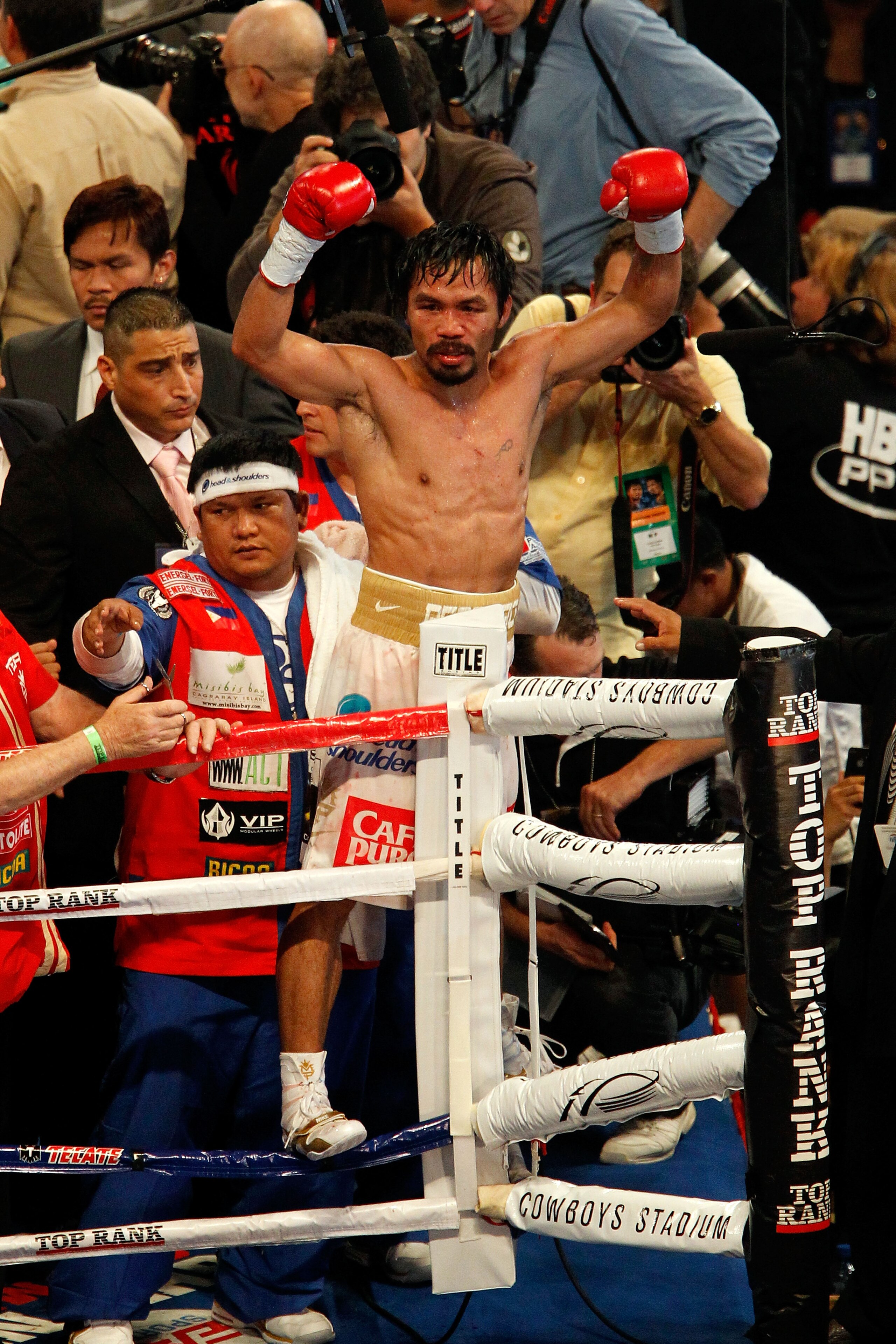 ARLINGTON, TX - NOVEMBER 13: Manny Pacquiao (white trunks) of the Philippines celebrates after he was declared the winner by a unanimous decision against Antonio Margarito (black trunks) of Mexico during their WBC World Super Welterweight Title bout at C ARLINGTON, TX - NOVEMBER 13: Manny Pacquiao (white trunks) of the Philippines celebrates after he was declared the winner by a unanimous decision against Antonio Margarito (black trunks) of Mexico during their WBC World Super Welterweight Title bout at C