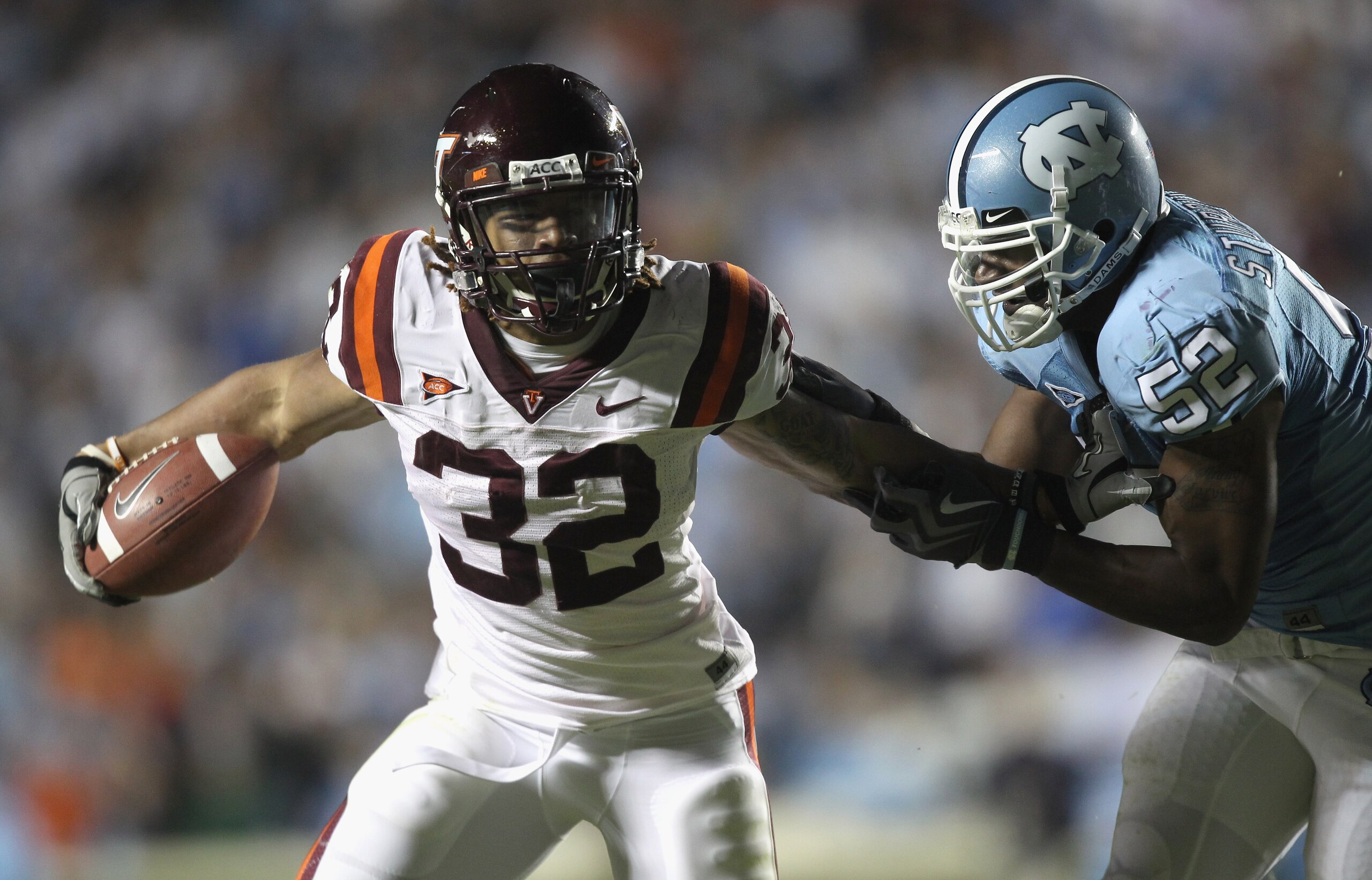 CHAPEL HILL, NC - NOVEMBER 13: Darren Evans #32 of the Virginia Tech Hokies is tackled by Quan Sturdivant #52 of the North Carolina Tar Heels during their game at Kenan Stadium on November 13, 2010 in Chapel Hill, North Carolina. (Photo by Streeter Leck CHAPEL HILL, NC - NOVEMBER 13: Darren Evans #32 of the Virginia Tech Hokies is tackled by Quan Sturdivant #52 of the North Carolina Tar Heels during their game at Kenan Stadium on November 13, 2010 in Chapel Hill, North Carolina. (Photo by Streeter Leck