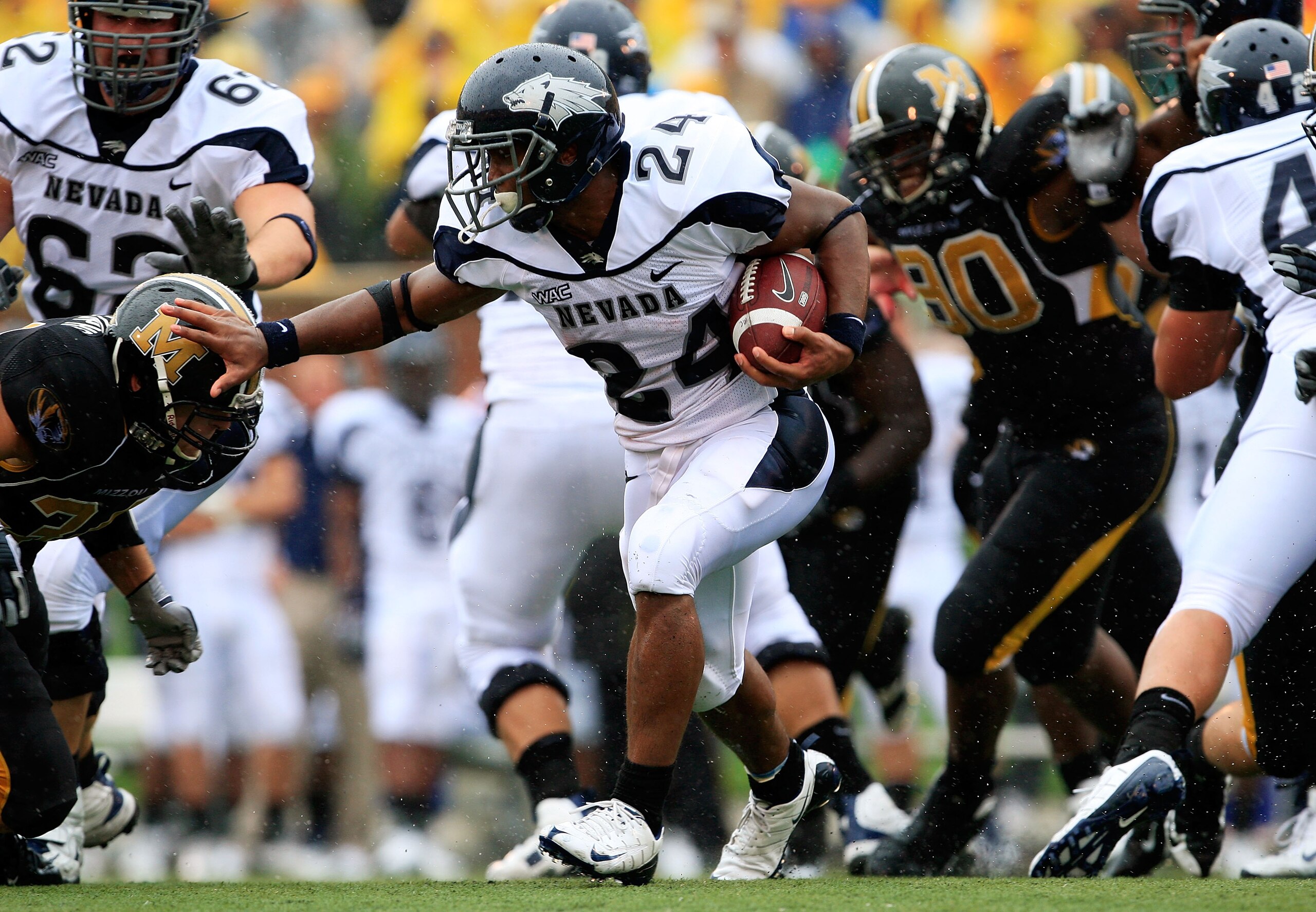 COLUMBIA, MO - SEPTEMBER 13: Vai Taua #34 the Nevada Wolf Pack carries the ball during the first half of the game against the Missouri Tigers on September 13, 2008 at Memorial Stadium in Columbia, Missouri. (Photo by Jamie Squire/Getty Images) COLUMBIA, MO - SEPTEMBER 13: Vai Taua #34 the Nevada Wolf Pack carries the ball during the first half of the game against the Missouri Tigers on September 13, 2008 at Memorial Stadium in Columbia, Missouri. (Photo by Jamie Squire/Getty Images)