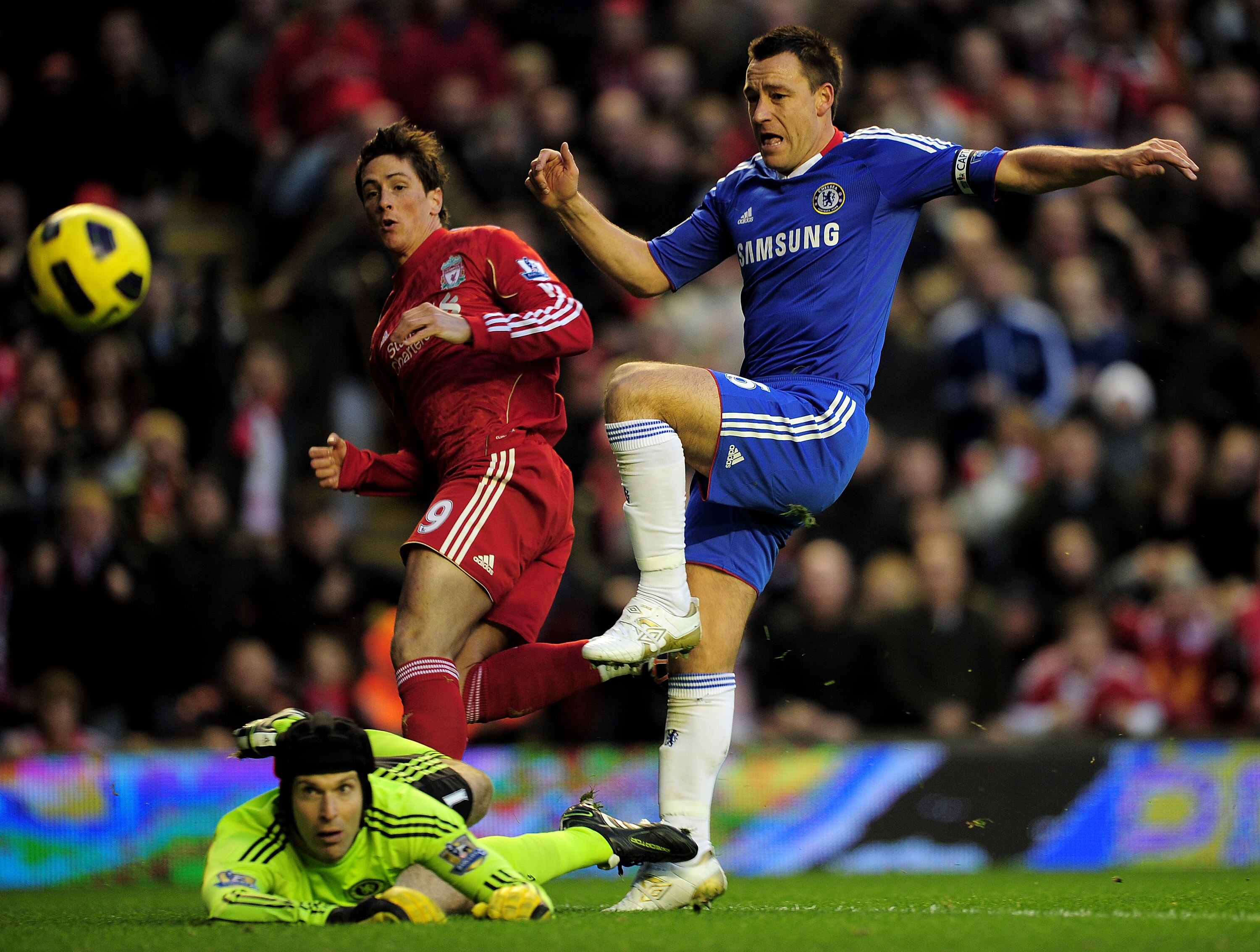 LIVERPOOL, ENGLAND - NOVEMBER 07:  John Terry (R) and Petr Cech of Chelsea are unable to stop Fernando Torres of Liverpool scoring the opening goal during the Barclays Premier League match between Liverpool and Chelsea at Anfield on November 7, 2010 in Li
