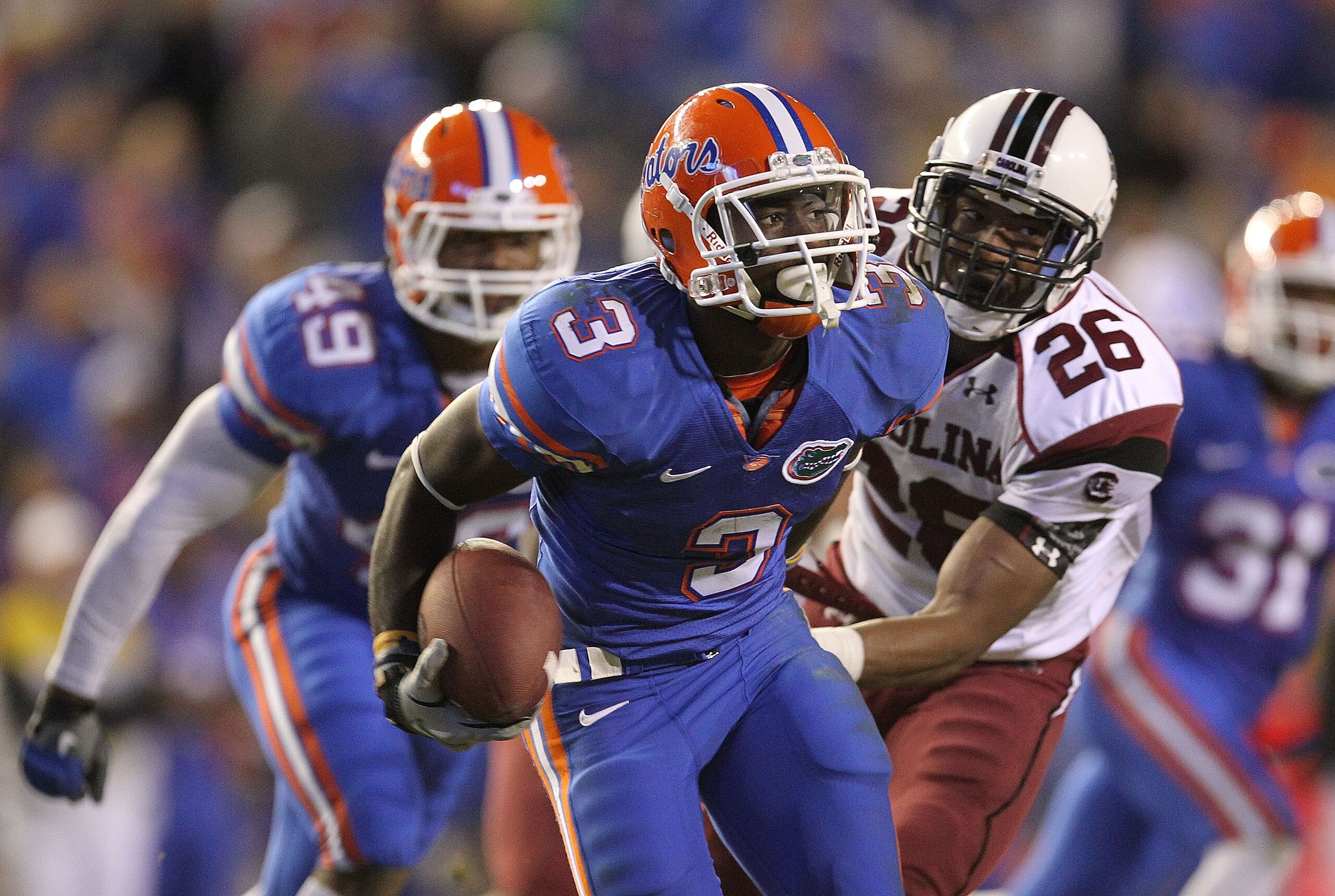 GAINESVILLE, FL - NOVEMBER 13: Chris Rainey #3 of the Florida Gators rushes after a catch against Antonio Allen #26 of the South Carolina Gamecocks during a game at Ben Hill Griffin Stadium on November 13, 2010 in Gainesville, Florida. (Photo by Mike Ehr GAINESVILLE, FL - NOVEMBER 13: Chris Rainey #3 of the Florida Gators rushes after a catch against Antonio Allen #26 of the South Carolina Gamecocks during a game at Ben Hill Griffin Stadium on November 13, 2010 in Gainesville, Florida. (Photo by Mike Ehr