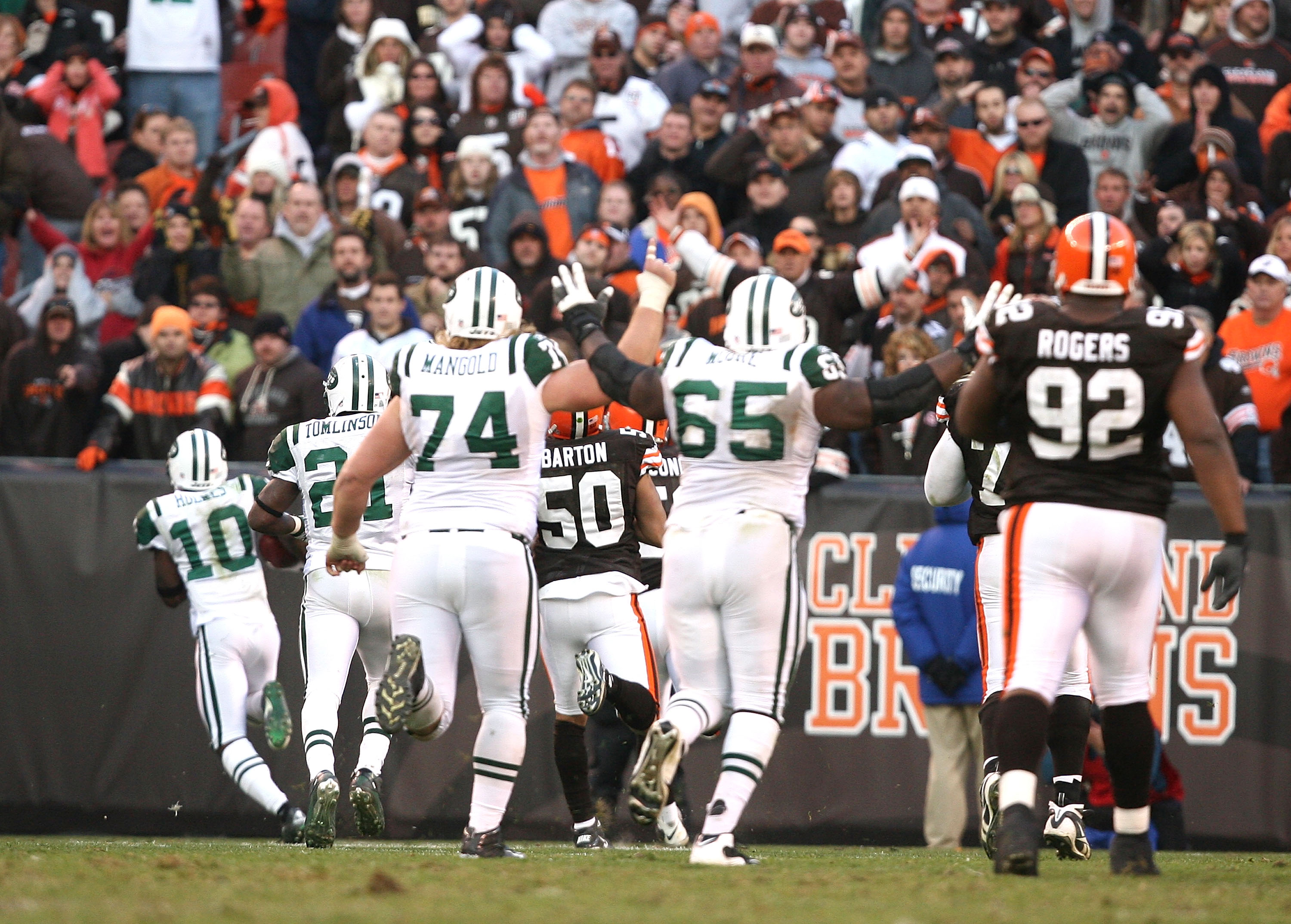 CLEVELAND - NOVEMBER 14:  Wide receiver Santonio Holmes #10 of the New York Jets scores a touchdown in overtime against the Cleveland Browns at Cleveland Browns Stadium on November 14, 2010 in Cleveland, Ohio.  (Photo by Matt Sullivan/Getty Images)