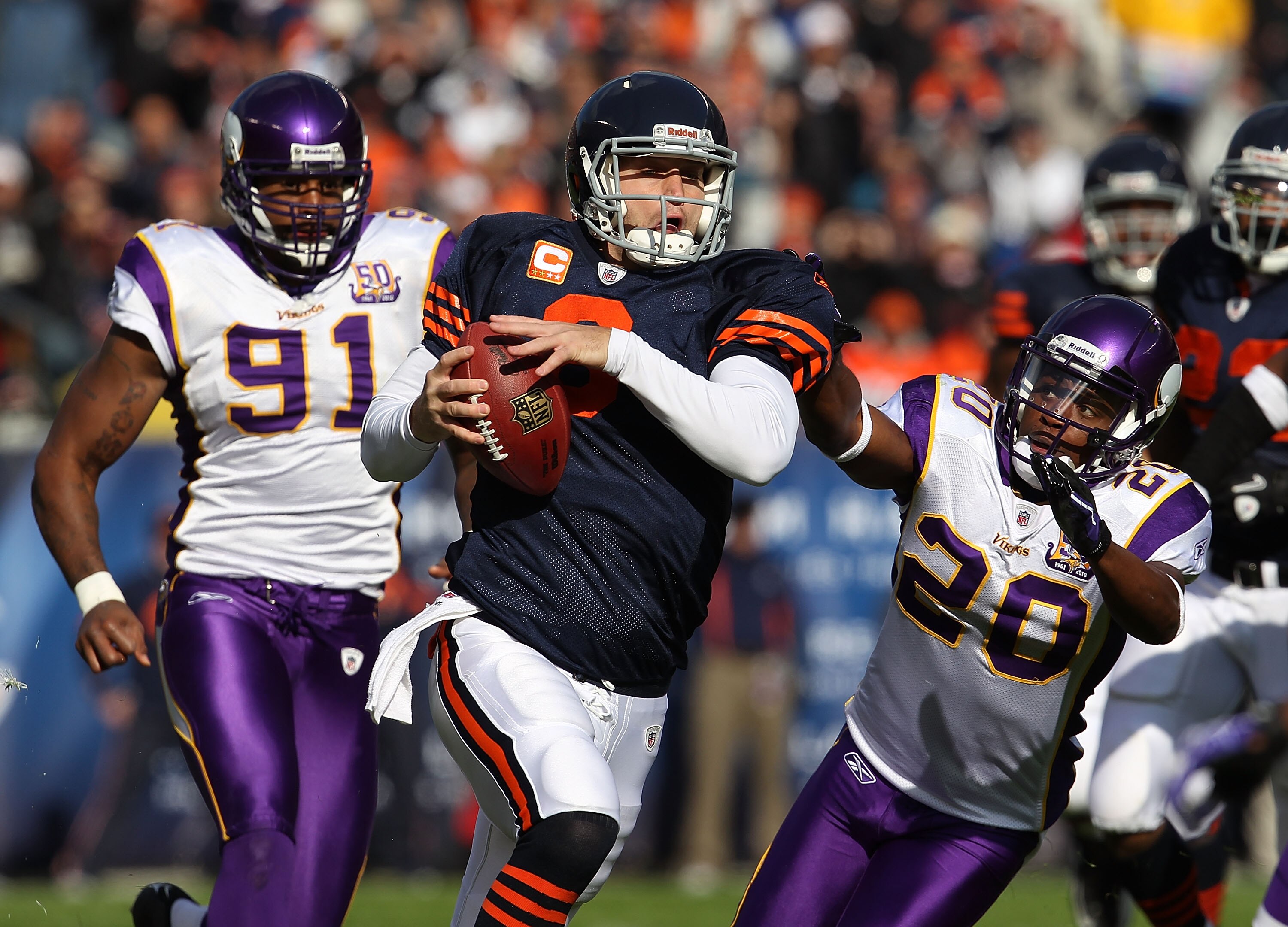 CHICAGO - NOVEMBER 14: Jay Cutler #6 of the Chicago Bears runs for a first down as Ray Edwards #91 and Madieu Williams #20 of the Minnesota Vikings give chase at Soldier Field on November 14, 2010 in Chicago, Illinois. (Photo by Jonathan Daniel/Getty Imag