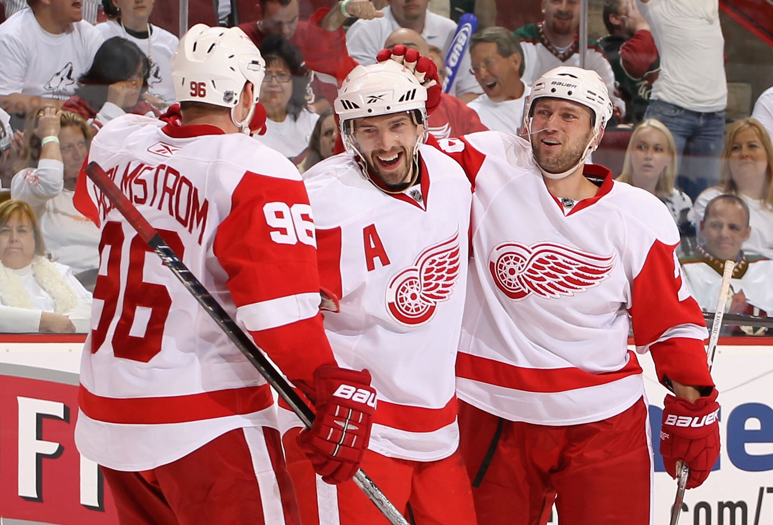 GLENDALE, AZ - APRIL 23:  Pavel Datsyuk #13 of the Detroit Red Wings is congratulated by teammates Tomas Holmstrom #96 and Brian Rafalski #28 after Datsyuk scored a third period goal against the Phoenix Coyotes in Game Five of the Western Conference Quart