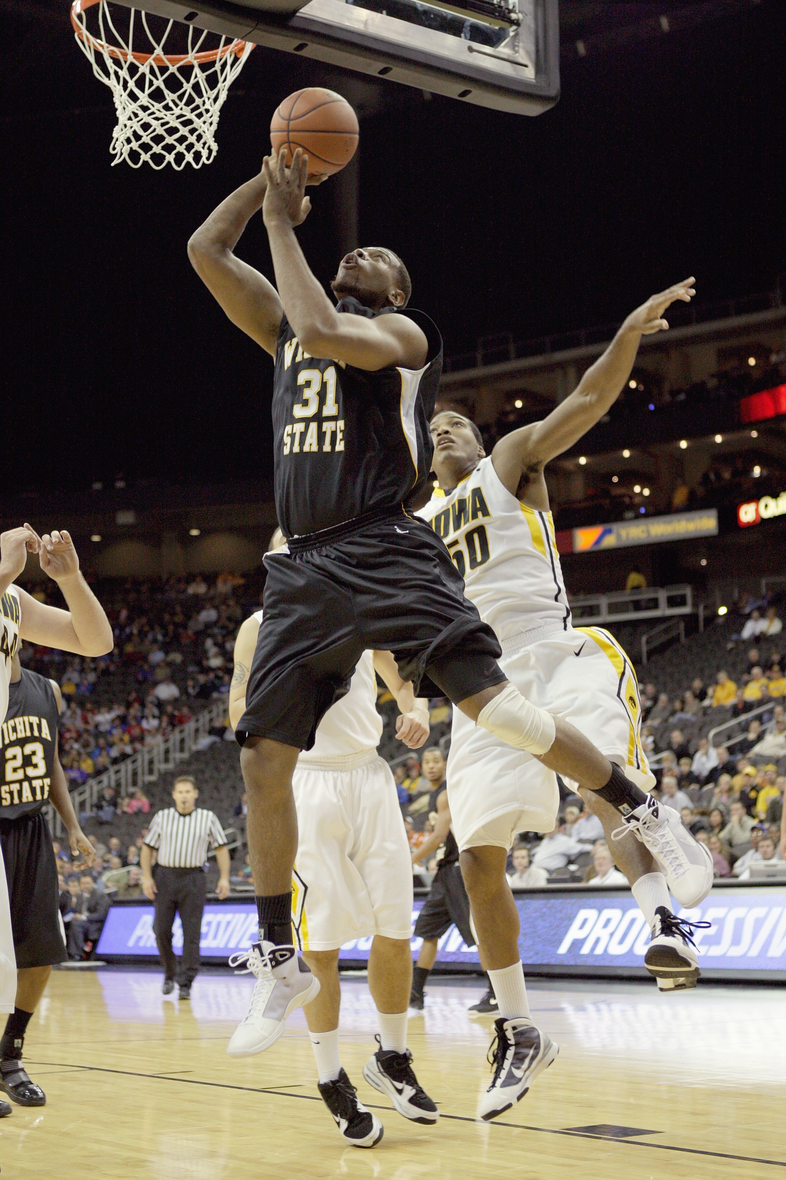 KANSAS CITY, MO - NOVEMBER 24: J.T. Durley #31 of the Wichita State Shockers puts a shot up against the Iowa Hawkeyes during the CBE Classic consolation game on November 24, 2009 at Sprint Center in Kansas City, Missouri. (Photo by: Jamie Squire/Getty Im KANSAS CITY, MO - NOVEMBER 24: J.T. Durley #31 of the Wichita State Shockers puts a shot up against the Iowa Hawkeyes during the CBE Classic consolation game on November 24, 2009 at Sprint Center in Kansas City, Missouri. (Photo by: Jamie Squire/Getty Im