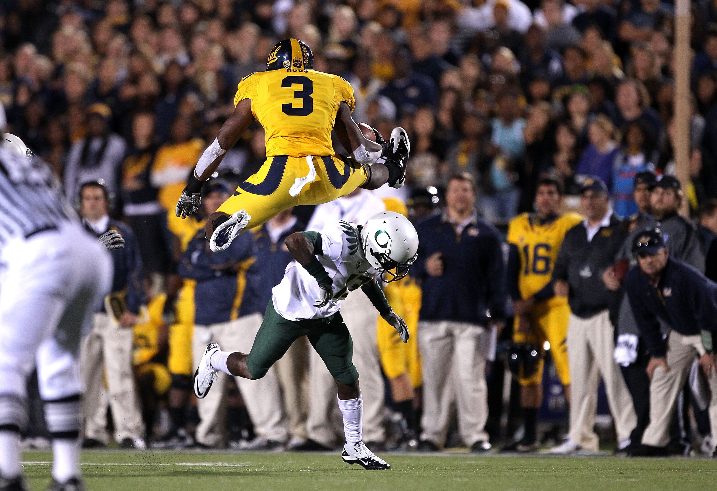 BERKELEY, CA - NOVEMBER 13:  Jeremy Ross #3 of the California Golden Bears jumps over Cliff Harris #13 of the Oregon Ducks at California Memorial Stadium on November 13, 2010 in Berkeley, California.  (Photo by Ezra Shaw/Getty Images)