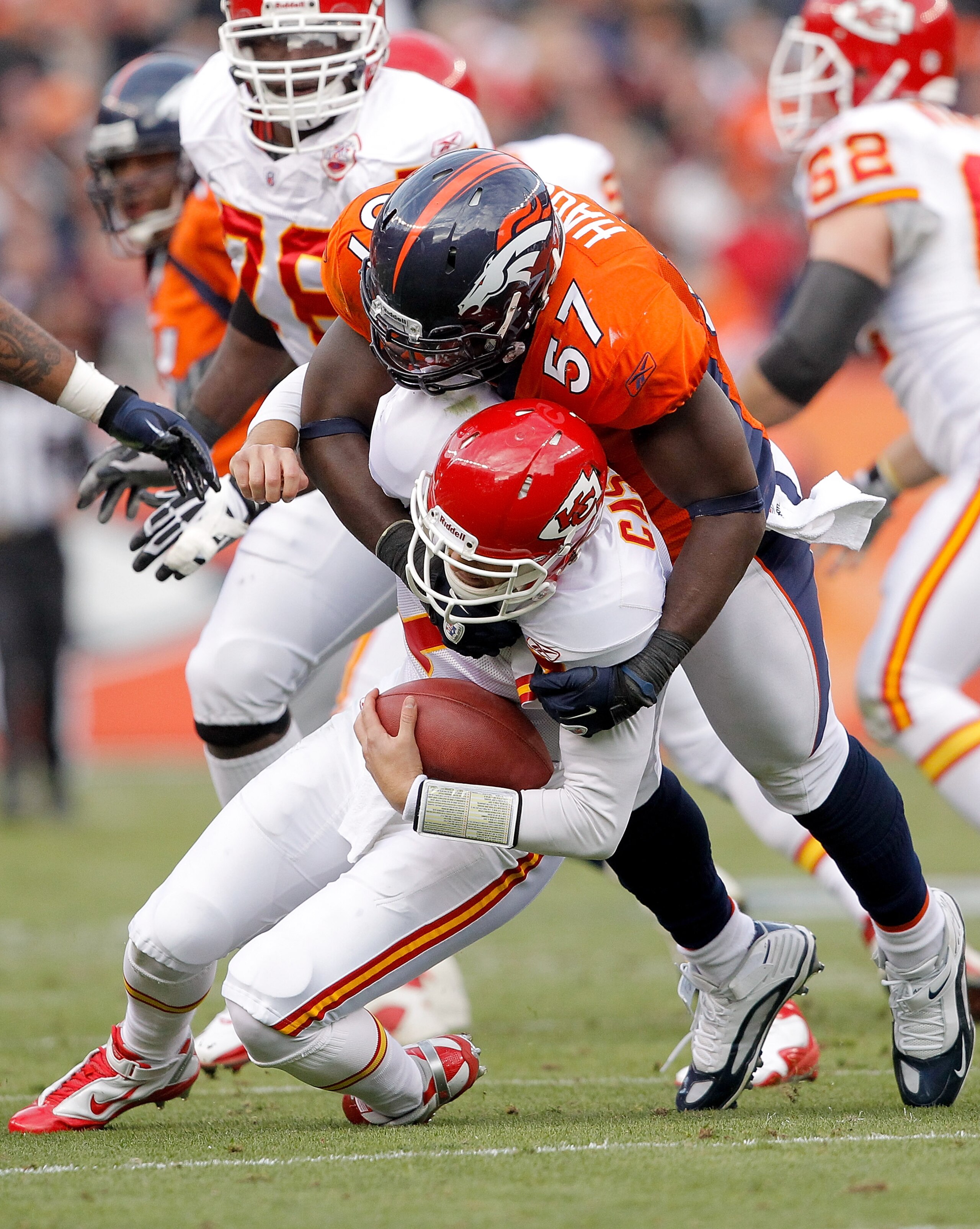 DENVER - OCTOBER 24:  Linebacker Mario Haggan #57 of the Denver Broncos sacks quarterback Matt Cassel #7 of the Kansas City Chiefs during the first quarter at INVESCO Field at Mile High on November 14, 2010 in Denver, Colorado. (Photo by Justin Edmonds/Ge