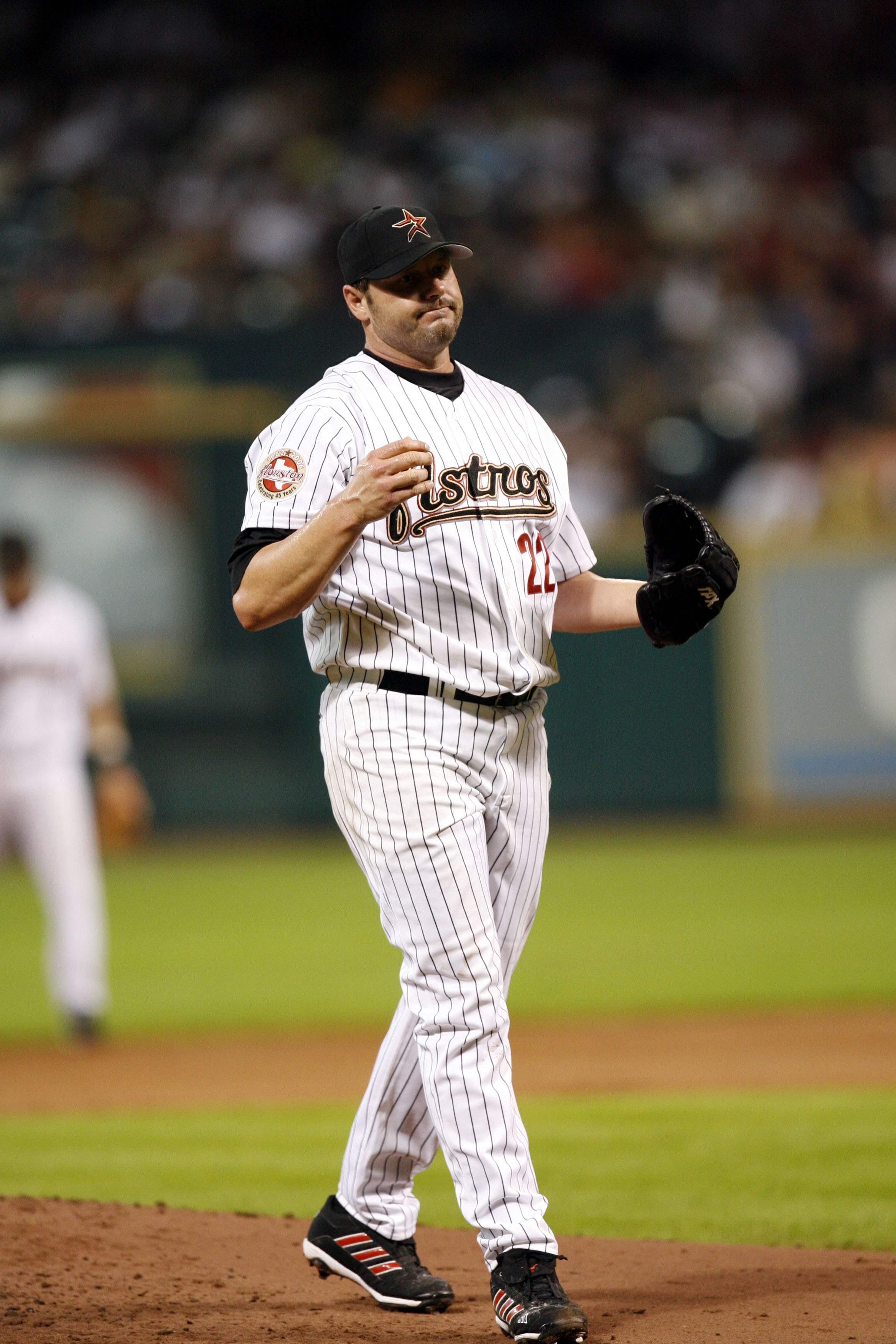 HOUSTON - JUNE 22:  Roger Clemens #22 of the Houston Astros pitches against the Minnesota Twins at Minute Maid Park on June 22, 2006 in Houston, Texas. The Twins defeated the Astros 4-2. (Photo by Bill Baptist/Getty Images)