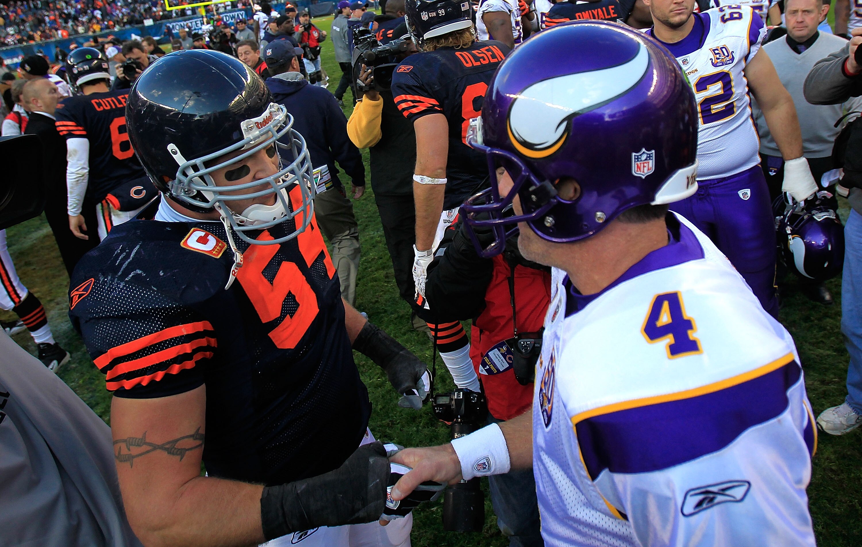 CHICAGO - NOVEMBER 14: Brian Urlacher #54 of the Chicago Bears shakes hands with Brett Favre #4 of the Minnesota Vikings after a win by the Bears at Soldier Field on November 14, 2010 in Chicago, Illinois. The Bears defeated the Vikings 27-13. (Photo by J
