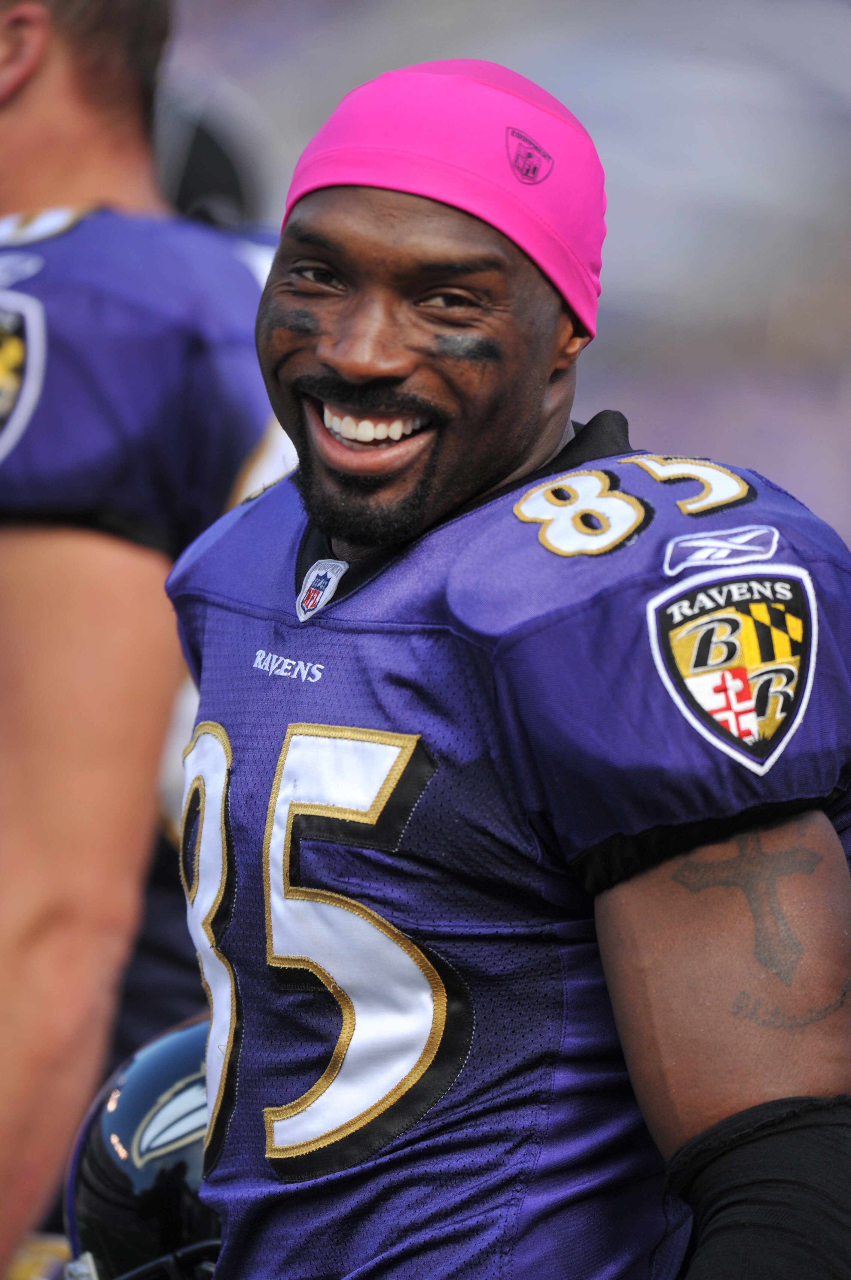 BALTIMORE, MD - OCTOBER 10: Derrick Mason #85 of the Baltimore Ravens smiles on the sideline during the game against the Denver Broncos at M&T Bank Stadium on October 10, 2010 in Baltimore, Maryland. Players wore pink in recognition of Breast Cancer Aware