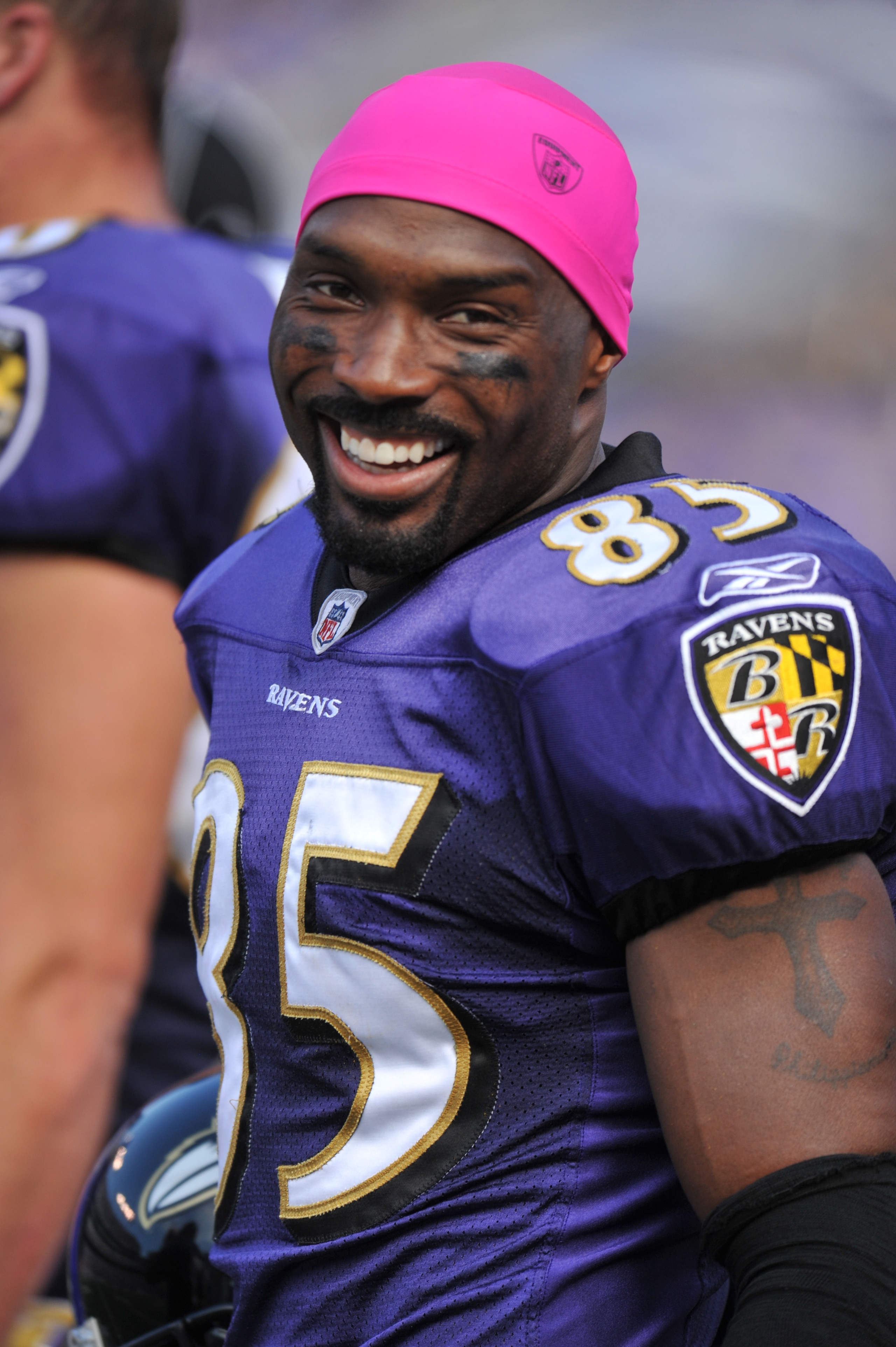BALTIMORE, MD - OCTOBER 10: Derrick Mason #85 of the Baltimore Ravens smiles on the sideline during the game against the Denver Broncos at M&T Bank Stadium on October 10, 2010 in Baltimore, Maryland. Players wore pink in recognition of Breast Cancer Aware BALTIMORE, MD - OCTOBER 10: Derrick Mason #85 of the Baltimore Ravens smiles on the sideline during the game against the Denver Broncos at M&T Bank Stadium on October 10, 2010 in Baltimore, Maryland. Players wore pink in recognition of Breast Cancer Aware