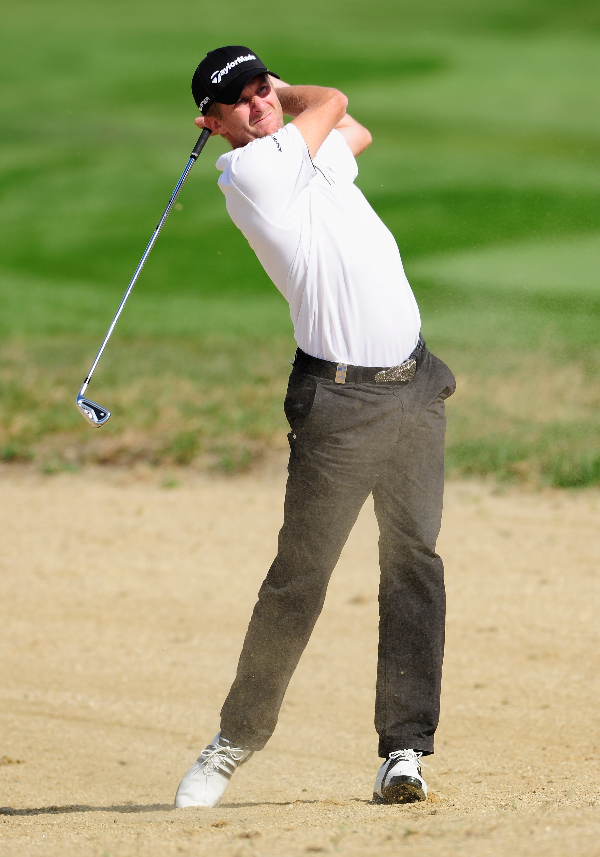 VIENNA, AUSTRIA - SEPTEMBER 19:  David Lynn of England plays his approach shot on the sixth hole the final round of the Austrian golf open presented by Botarin at the Diamond country club on September 19, 2010 in Atzenbrugg near Vienna, Austria.  (Photo b