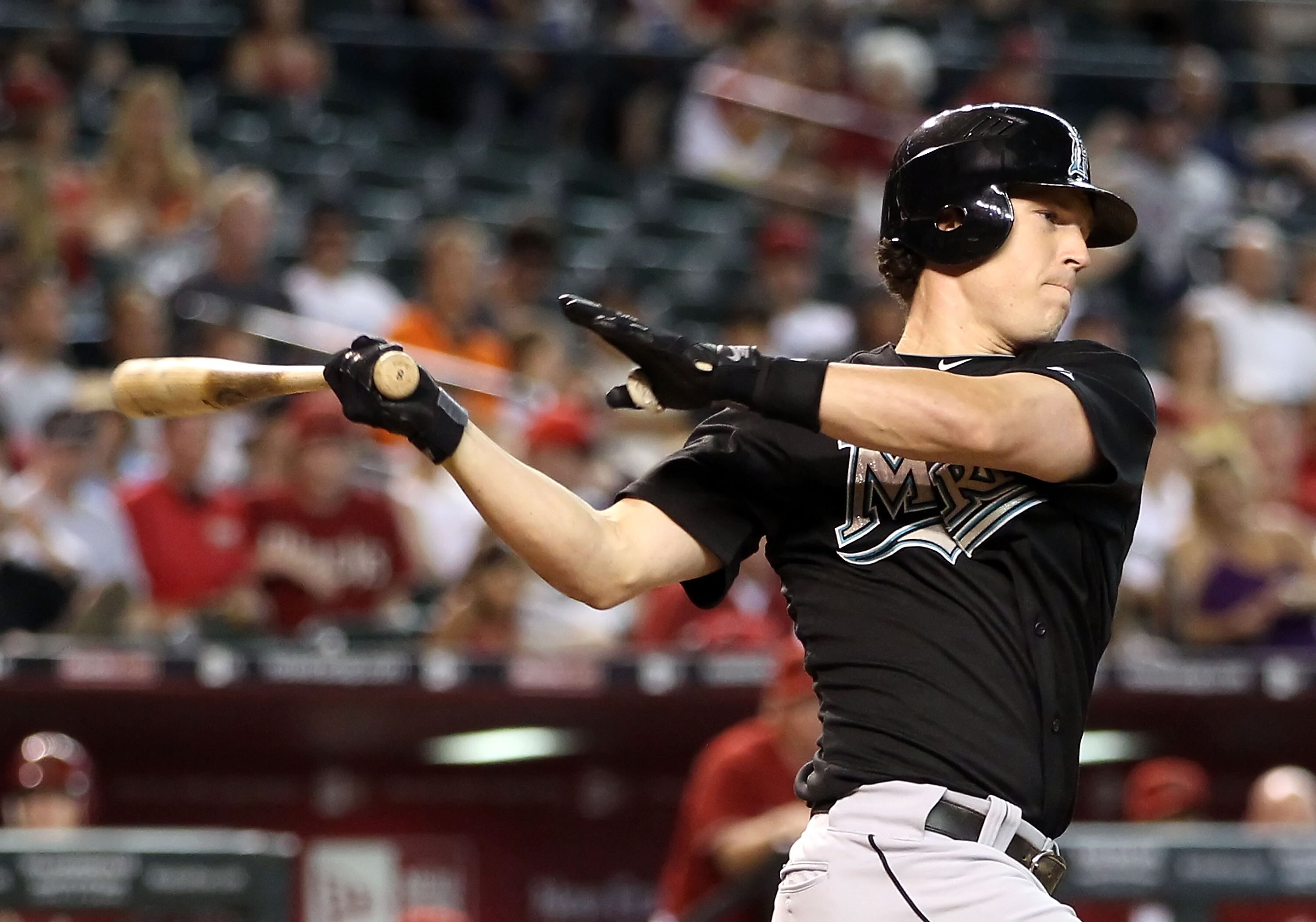 PHOENIX - JULY 11:  Chris Coghlan #8 of the Florida Marlins bats against the Arizona Diamondbacks during the Major League Baseball game at Chase Field on July 11, 2010 in Phoenix, Arizona.  The Marlins defeated the Diamondbacks 2-0.  (Photo by Christian P