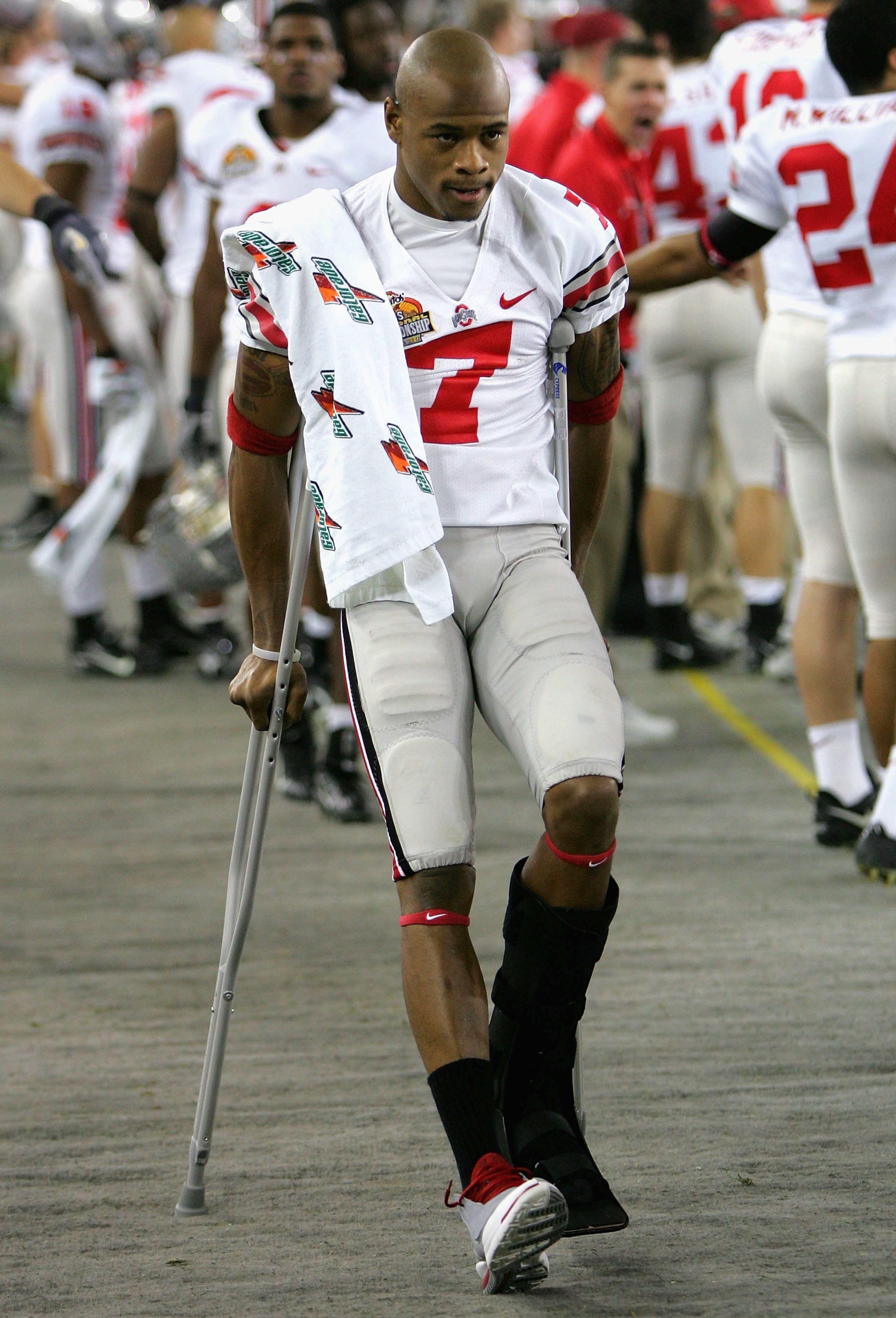 GLENDALE, AZ - JANUARY 08: Ted Ginn Jr. #7 of the Ohio State Buckeyes walks on the sidelines in crutches after being injured in the first quarter of the 2007 Tostitos BCS National Championship Game against the Florida Gators at the University of Phoenix GLENDALE, AZ - JANUARY 08: Ted Ginn Jr. #7 of the Ohio State Buckeyes walks on the sidelines in crutches after being injured in the first quarter of the 2007 Tostitos BCS National Championship Game against the Florida Gators at the University of Phoenix