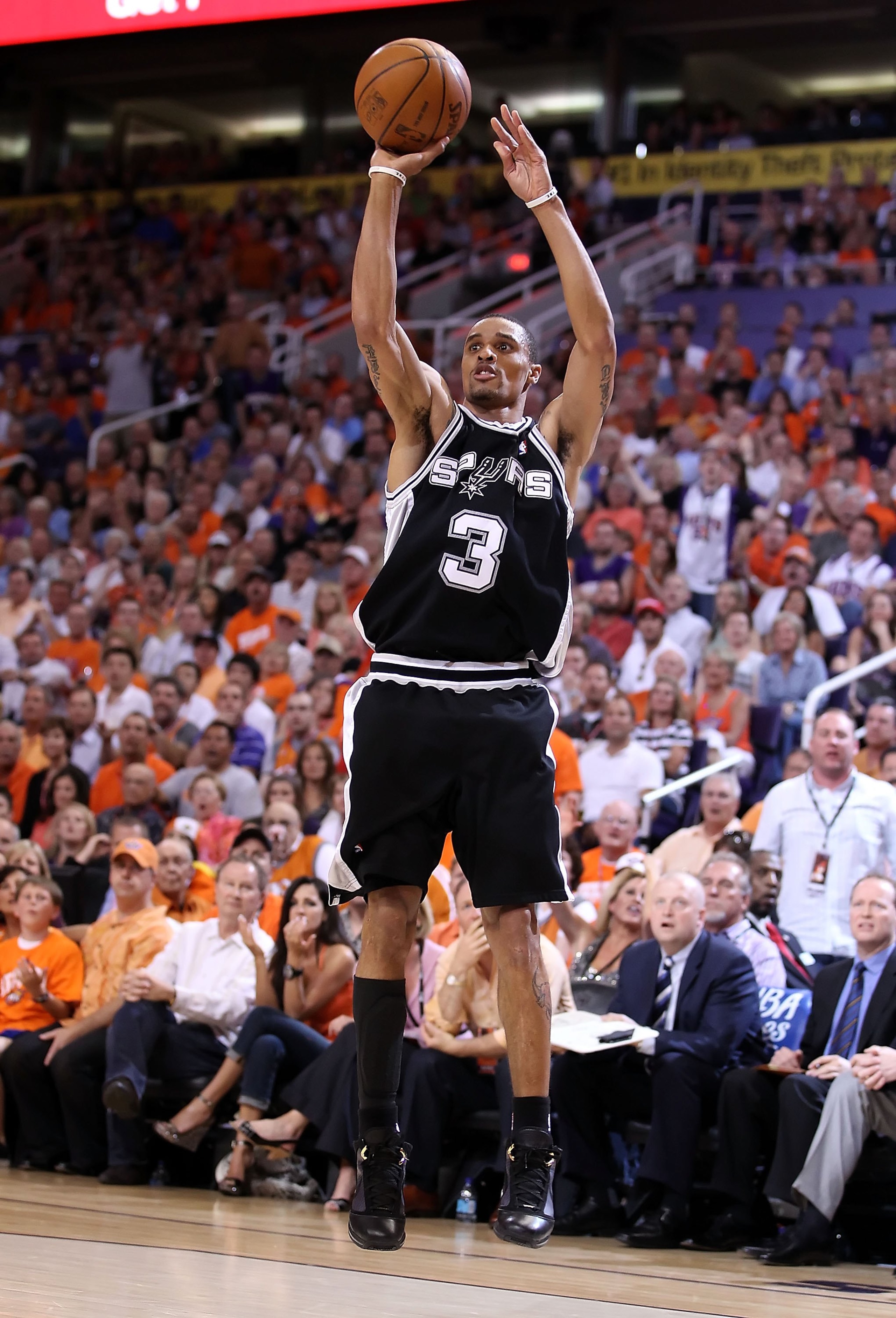 PHOENIX - MAY 05:  George Hill #3 of the San Antonio Spurs shoots the ball during Game Two of the Western Conference Semifinals of the 2010 NBA Playoffs against the Phoenix Suns at US Airways Center on May 5, 2010 in Phoenix, Arizona. The team is wearing