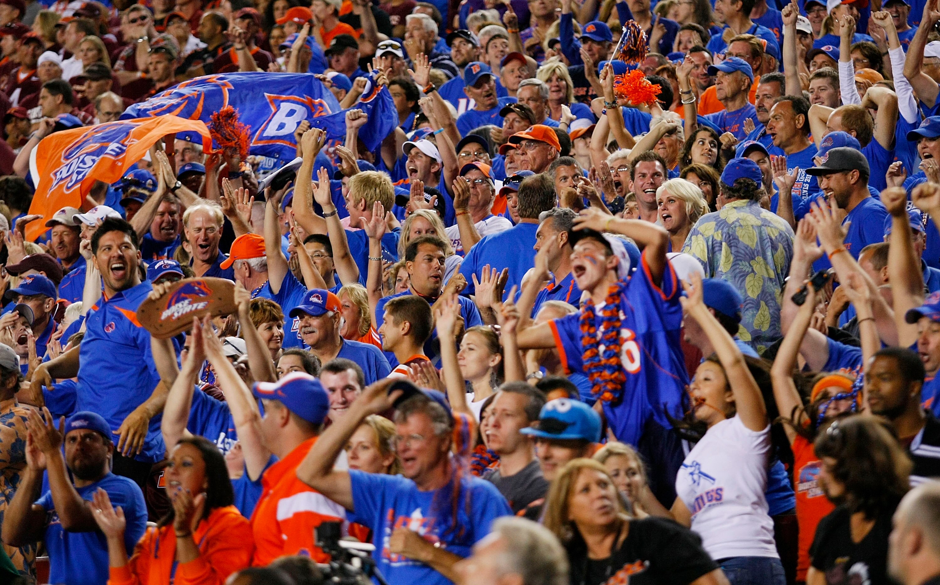 LANDOVER, MD - SEPTEMBER 06:  Boise State Broncos fans celebrate after defeating the Virginia Tech Hokies 33-30 at FedExField on September 6, 2010 in Landover, Maryland.  (Photo by Geoff Burke/Getty Images)
