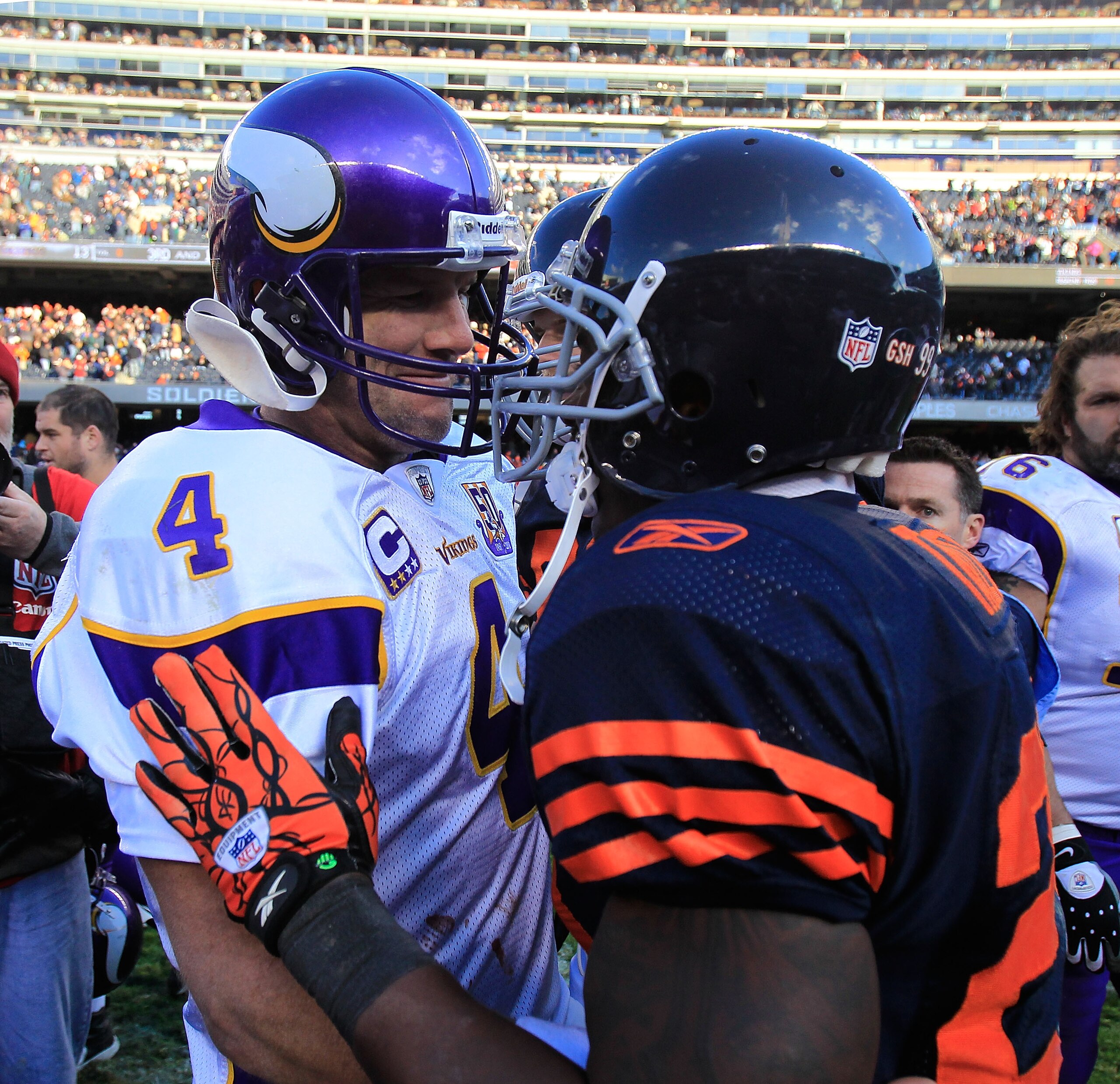 CHICAGO - NOVEMBER 14: Brett Favre #4 of the Minnesota Vikings talks with Chester Taylor #29 of the Chicago Bears following  a game at Soldier Field on November 14, 2010 in Chicago, Illinois. The Bears defeated the Vikings 27-13. (Photo by Jonathan Daniel