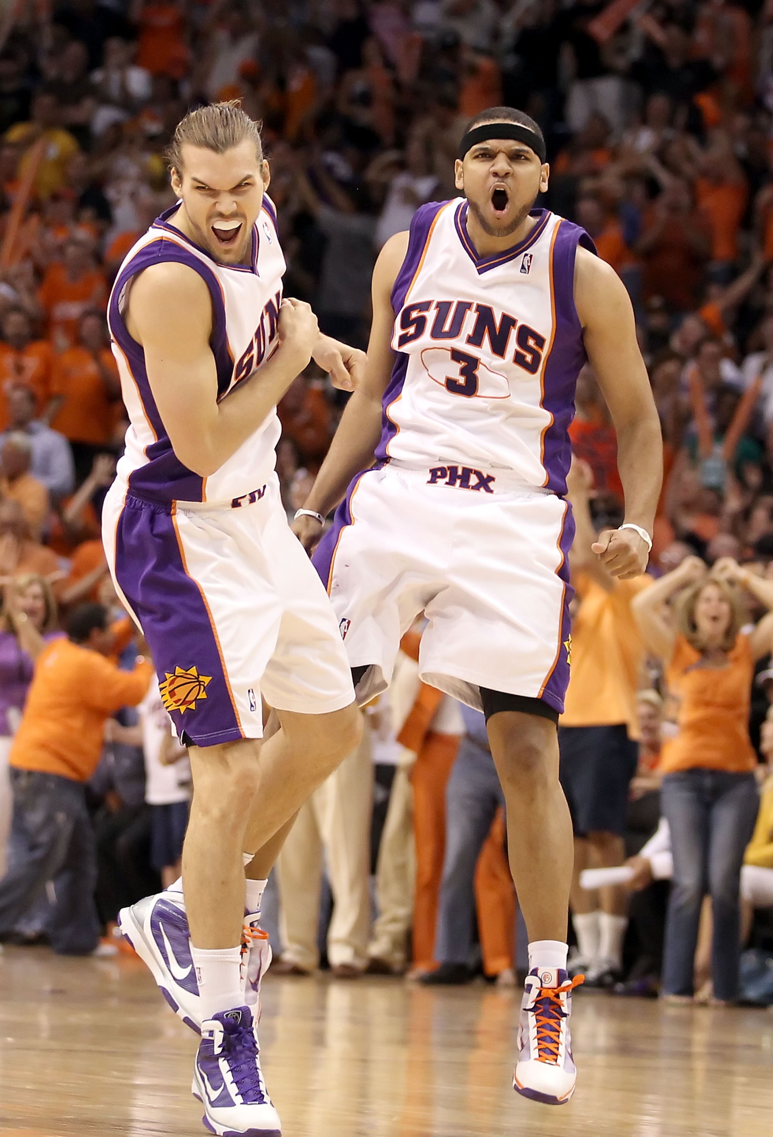 PHOENIX - MAY 25:  Jared Dudley #3 and Louis Amundson #17 of the Phoenix Suns celebrate after Dudley hit a 3 point shot against the Los Angeles Lakers in the fourth quarter of Game Four of the Western Conference finals of the 2010 NBA Playoffs at US Airwa