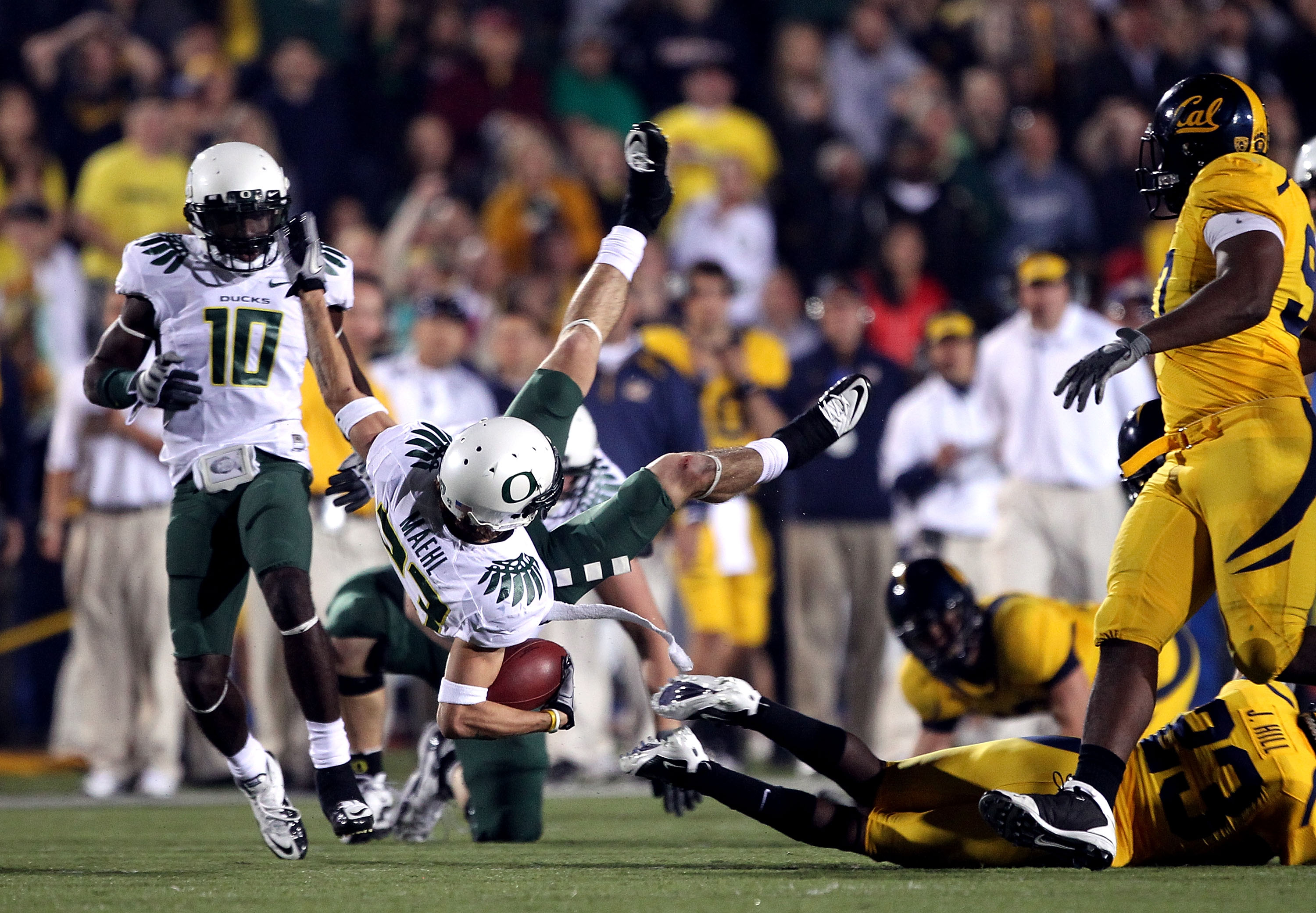 BERKELEY, CA - NOVEMBER 13:  Jeff Maehl #23 of the Oregon Ducks flies through the air after being hit by the California Golden Bears  at California Memorial Stadium on November 13, 2010 in Berkeley, California.  (Photo by Ezra Shaw/Getty Images)