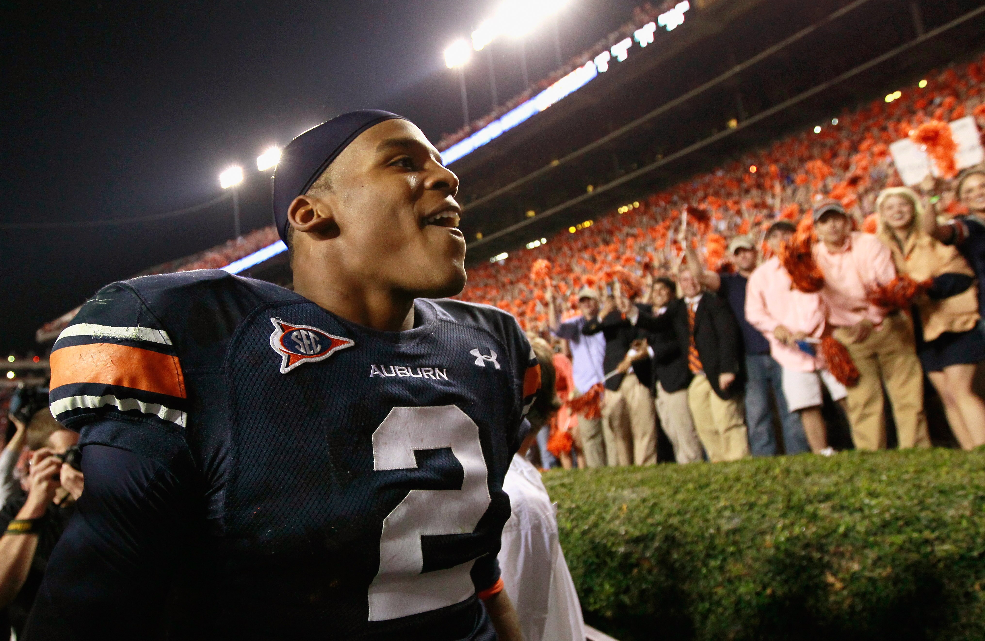 AUBURN, AL - NOVEMBER 13:  Quarterback Cameron Newton #2 of the Auburn Tigers celebrates with fans after their 49-31 win over the Georgia Bulldogs at Jordan-Hare Stadium on November 13, 2010 in Auburn, Alabama.  (Photo by Kevin C. Cox/Getty Images)