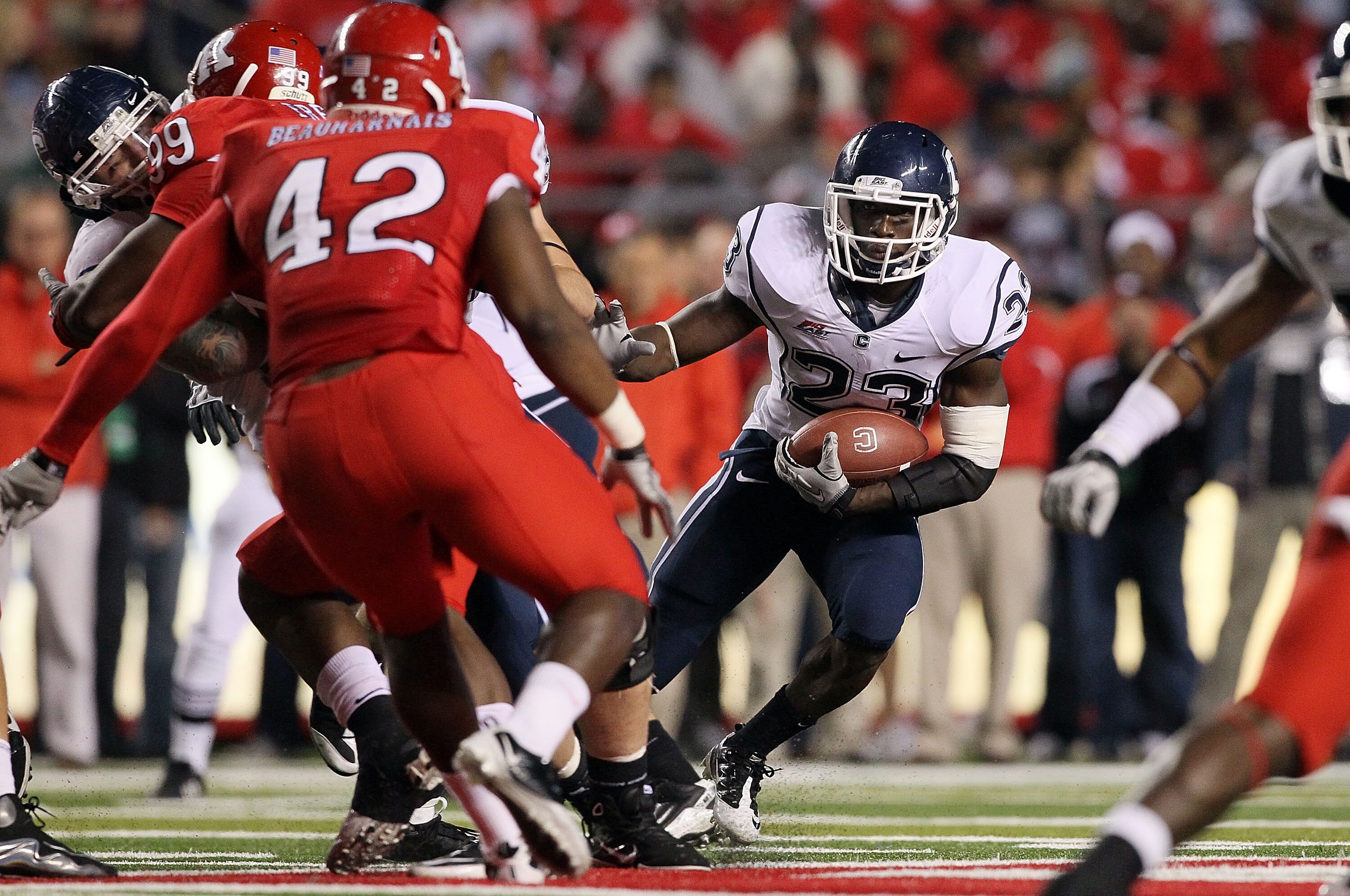 PISCATAWAY, NJ - OCTOBER 08:  Jordan Todman #23 of the Connecticut Huskies runs the ball against the Rutgers Scarlet Knights at Rutgers Stadium on October 8, 2010 in Piscataway, New Jersey. Rutgers defeated UConn 27-24.  (Photo by Jim McIsaac/Getty Images