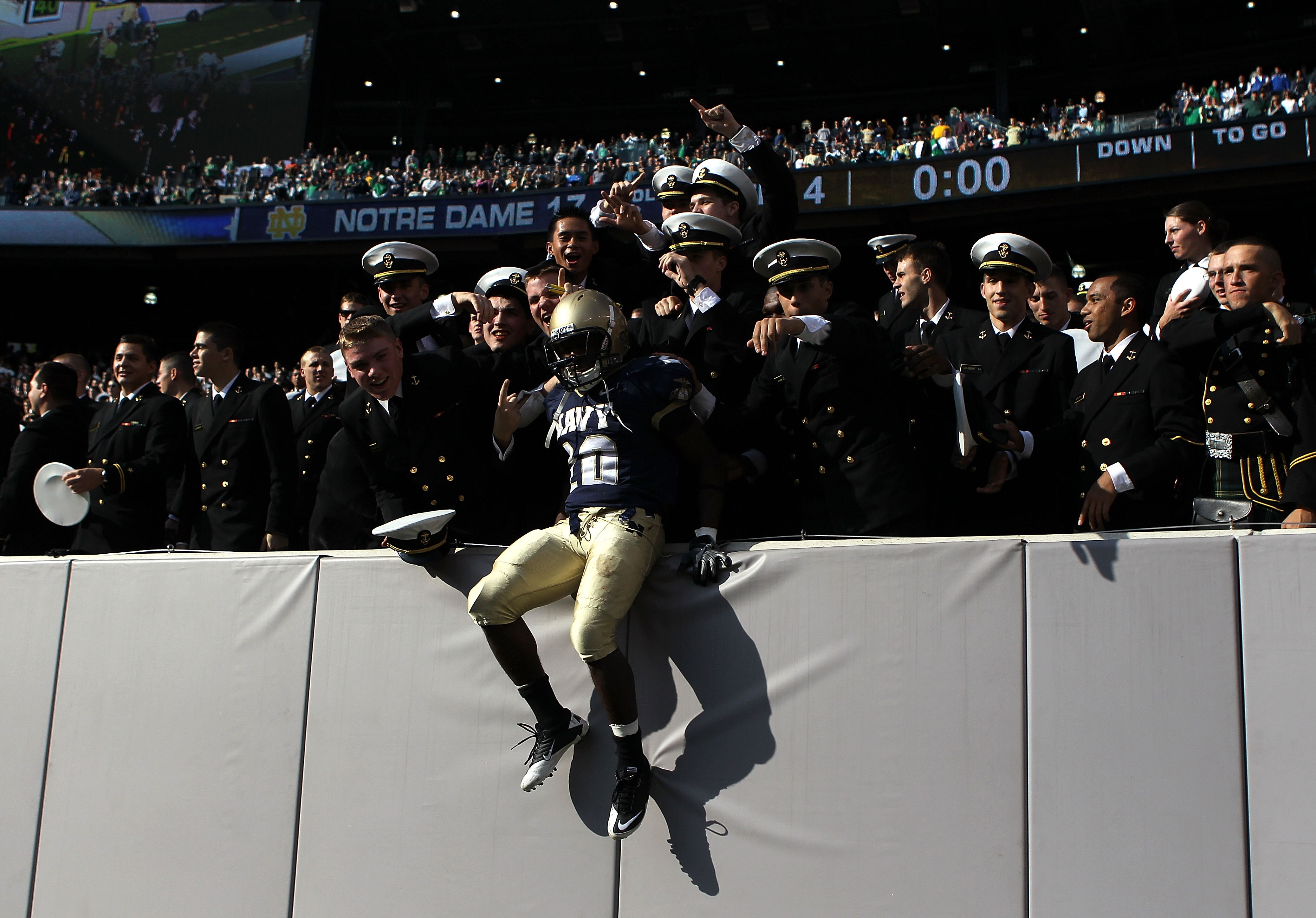 EAST RUTHERFORD, NJ - OCTOBER 23: Andre Byrd #20 of the Navy Midshipmen celebrates the win against the Notre Dame Fighting Irish at New Meadowlands Stadium on October 23, 2010 in East Rutherford, New Jersey.  (Photo by Nick Laham/Getty Images)