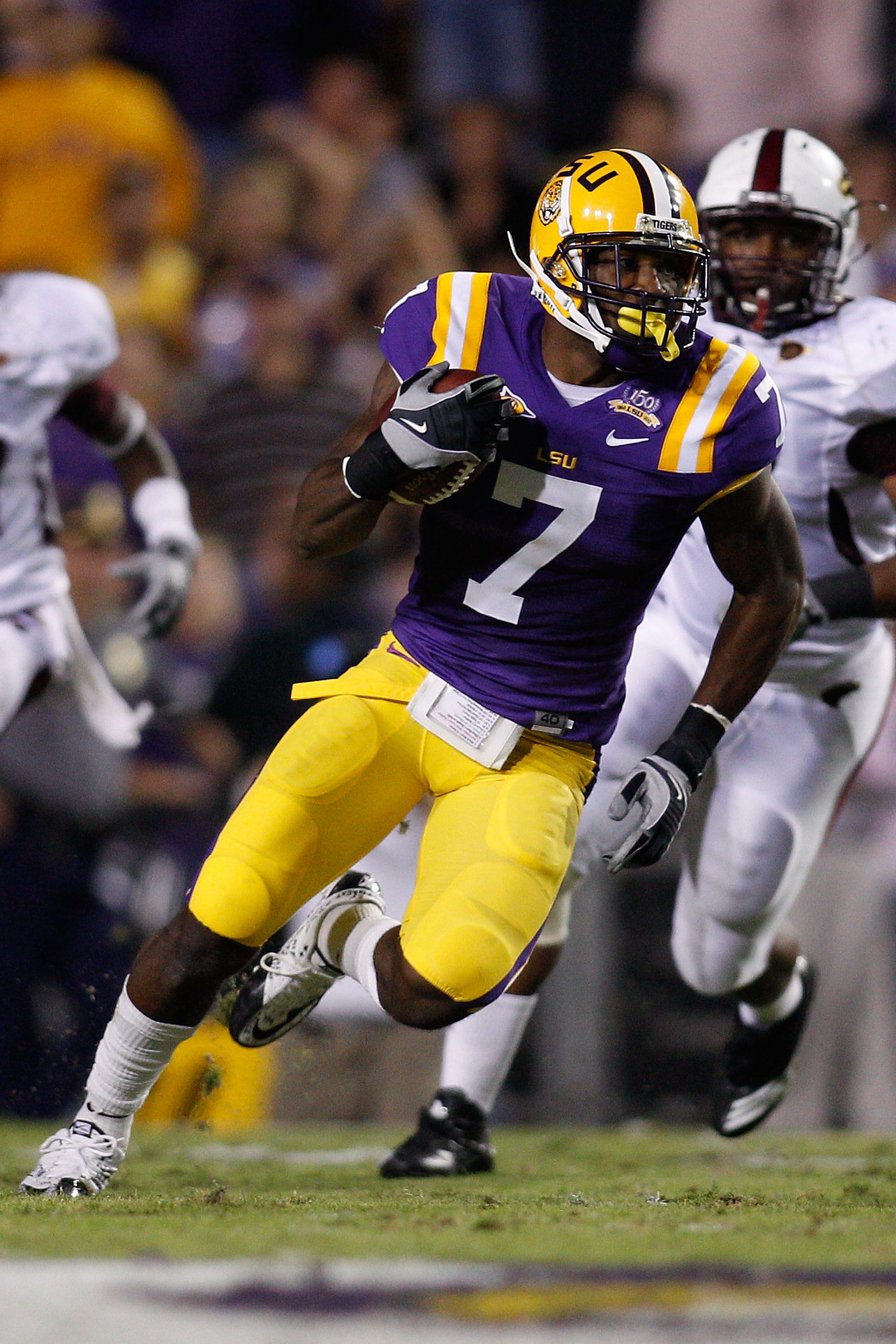 BATON ROUGE, LA - NOVEMBER 13:  Patrick Peterson #7 of the Louisiana State University Tigers runs back an interception against the Louisiana Monroe Warhawks at Tiger Stadium on November 13, 2010 in Baton Rouge, Louisiana.  (Photo by Chris Graythen/Getty I