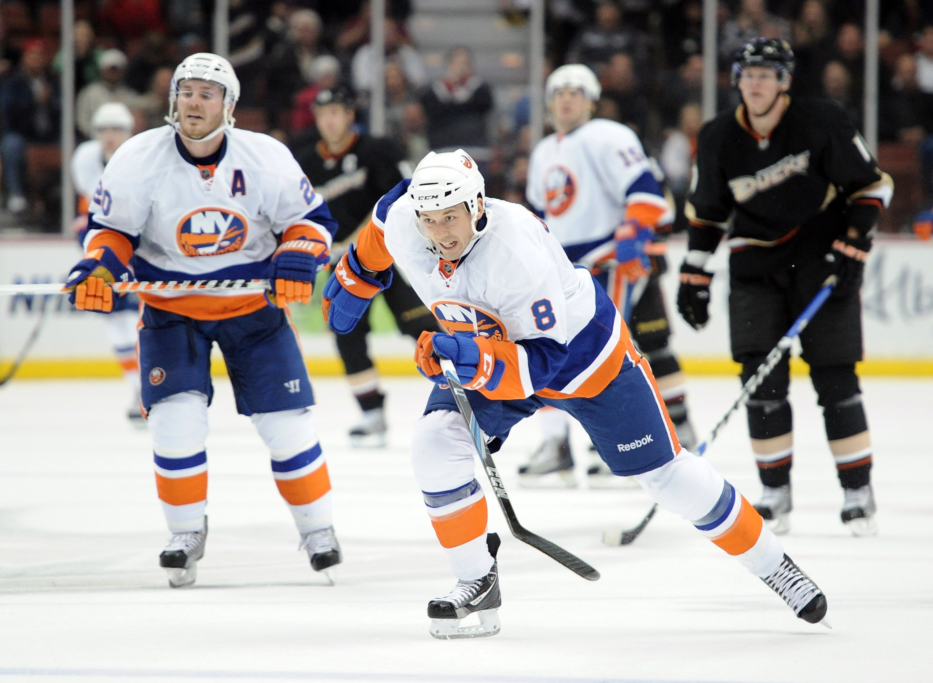 ANAHEIM, CA - NOVEMBER 10:  Bruno Gervais #8 of the New York Islanders skates back ahead of teammate James Wisniewski #20 and Corey Perry #10 of the Anaheim Ducks at the Honda Center on November 10, 2010 in Anaheim, California.  (Photo by Harry How/Getty 