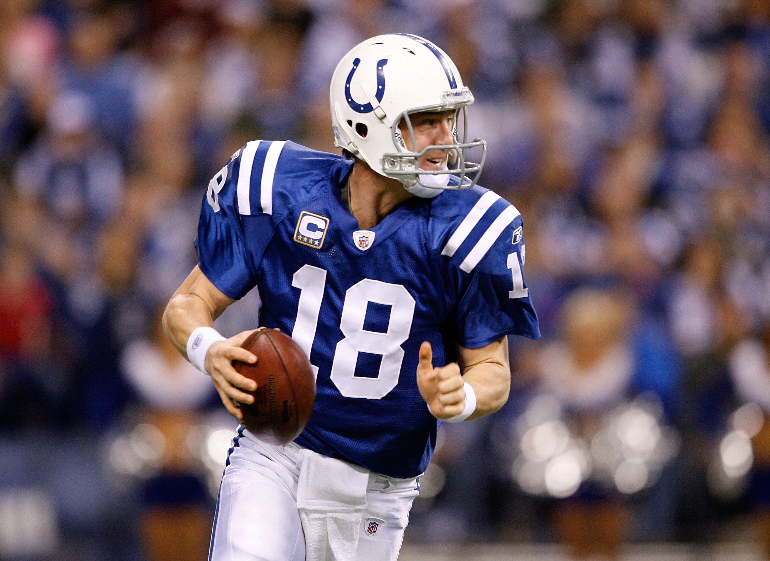 INDIANAPOLIS - DECEMBER 27:  Peyton Manning #18 of the Indianapolis Colts throws the ball during the NFL game against the New York Jets at Lucas Oil Stadium on December 27, 2009 in Indianapolis, Indiana.  (Photo by Andy Lyons/Getty Images)