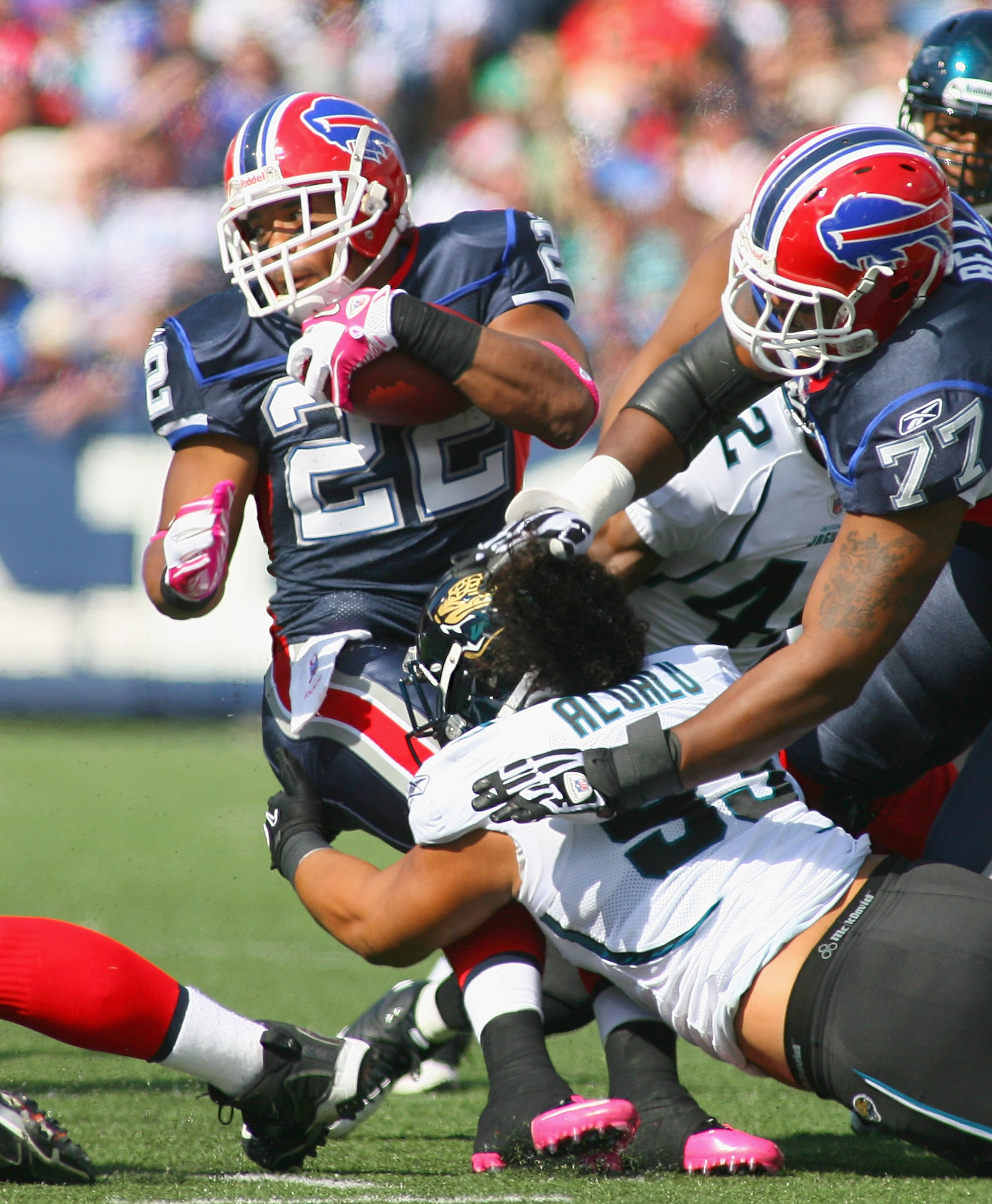 ORCHARD PARK, NY - OCTOBER 10: Fred Jackson #22 of the Buffalo Bills is tackled by Tyson Alualu #93 of the Jacksonville Jaguars at Ralph Wilson Stadium on October 10, 2010 in Orchard Park, New York. Jacksonville won 36-26. (Photo by Rick Stewart/Getty Ima
