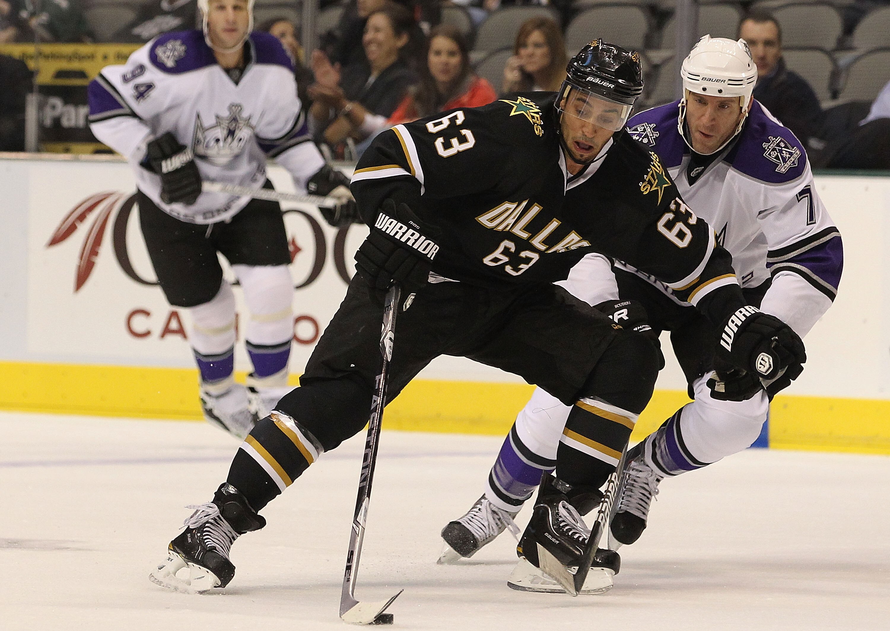 DALLAS - OCTOBER 28:  Center Mike Ribeiro #63 of the Dallas Stas skates the puck past Rob Scuderi #7 of the Los Angeles Kings on October 28, 2010 in Dallas, Texas.  (Photo by Ronald Martinez/Getty Images)