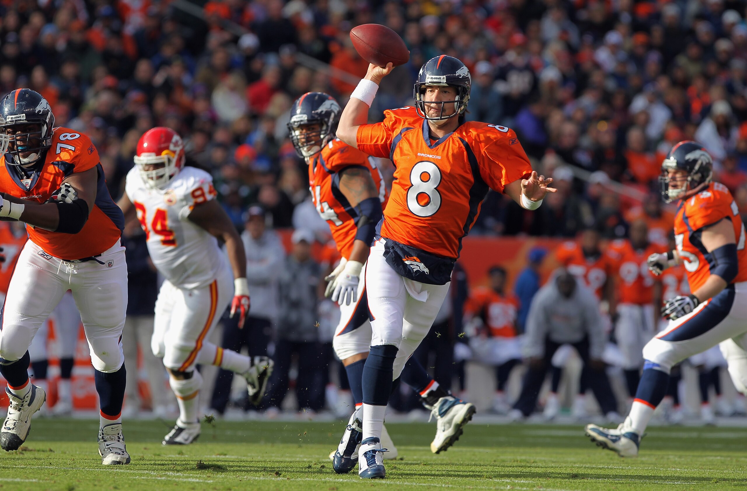 DENVER - NOVEMBER 14:  Quarterback Kyle Orton #8 of the Denver Broncos rolls out and delivers a pass against the Kansas City Chiefs in the first quarter at INVESCO Field at Mile High on November 14, 2010 in Denver, Colorado.  (Photo by Doug Pensinger/Gett