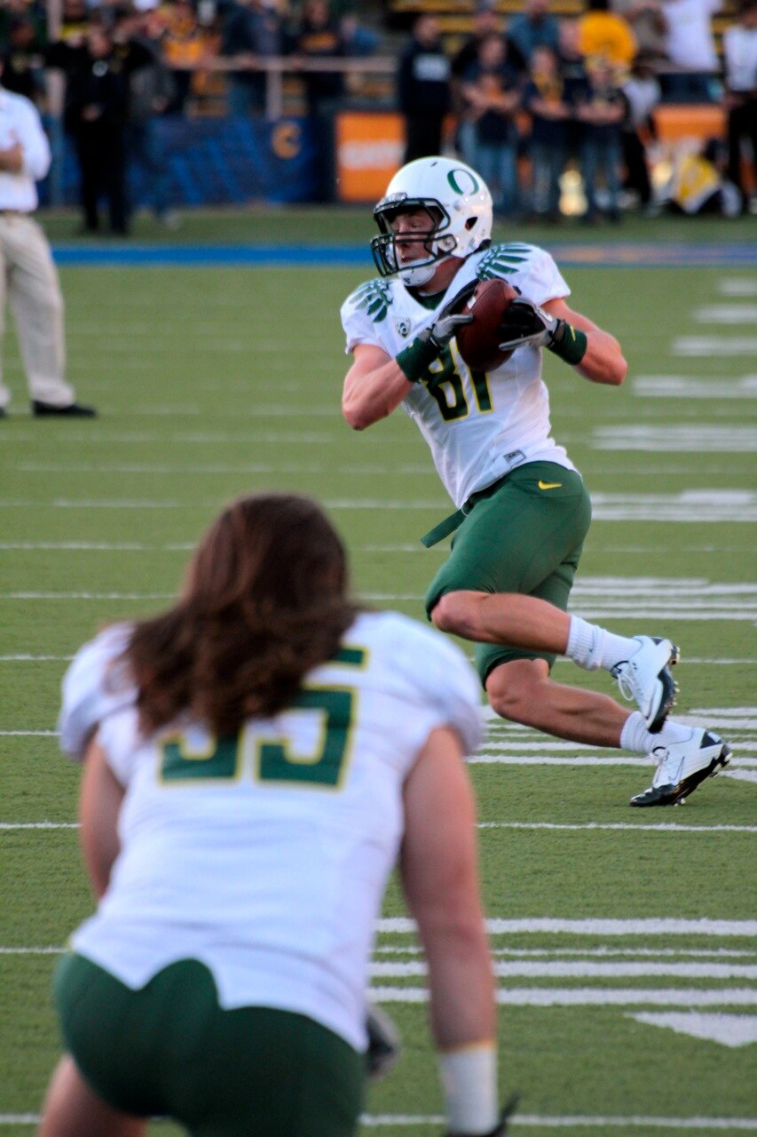 Casey Matthews watches Justin Hoffman warm up.