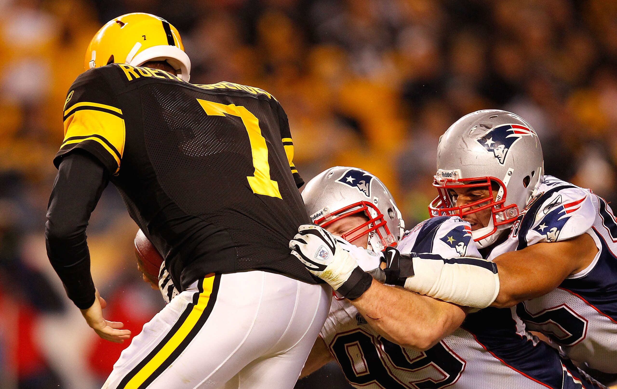 PITTSBURGH - NOVEMBER 14:  Ben Roethlisberger #7 of the Pittsburgh Steelers is sacked by Mike Wright #99 of the New England Patriots during the game on November 14, 2010 at Heinz Field in Pittsburgh, Pennsylvania.  (Photo by Jared Wickerham/Getty Images)