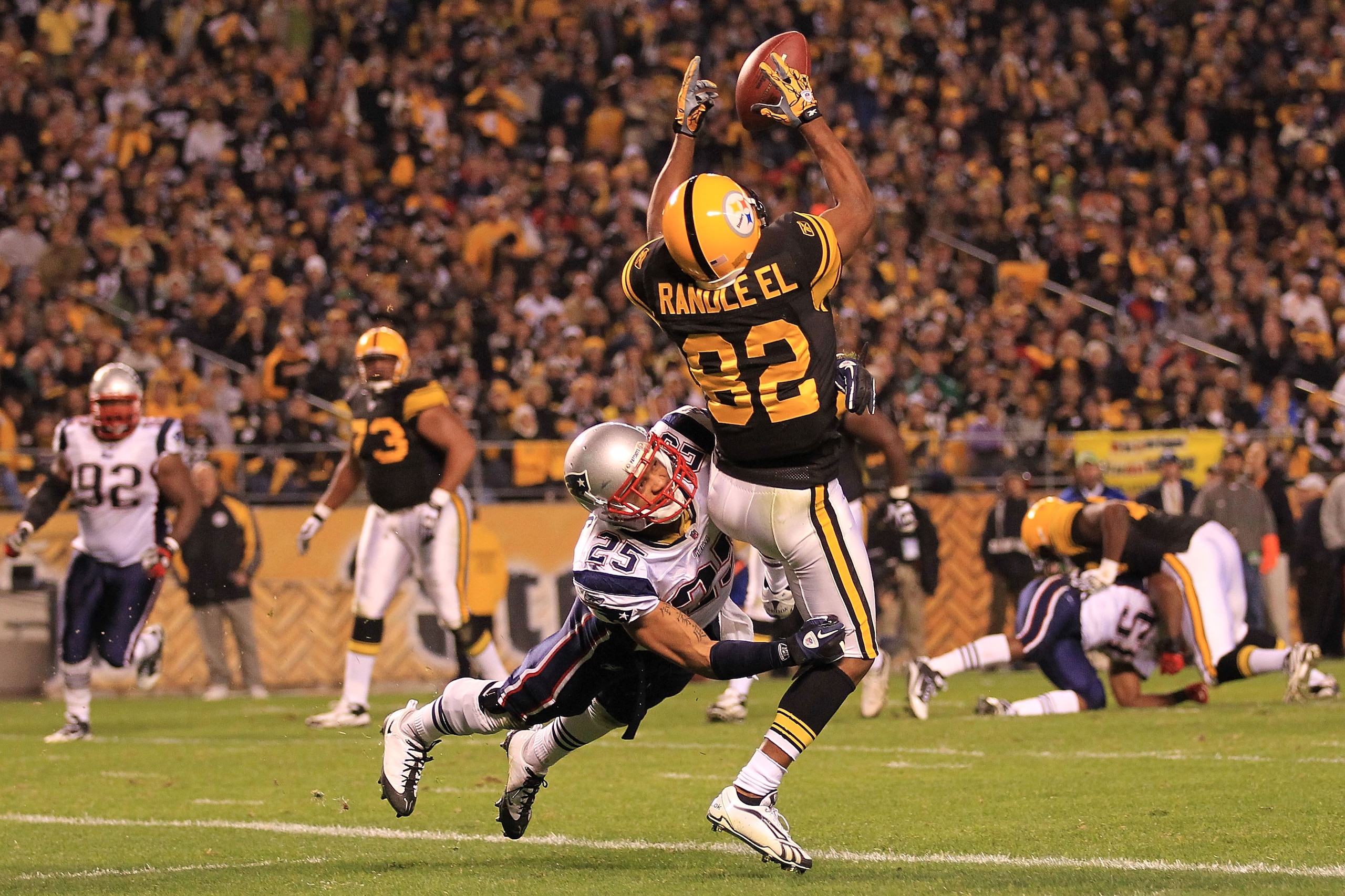 PITTSBURGH - NOVEMBER 14: Antwaan Randle El #82 of the Pittsburgh Steelers fumbles a catch in the endzone under pressure from Patrick Chung #25 of the New England Patriots on November 14, 2010 at Heinz Field in Pittsburgh, Pennsylvania.  (Photo by Chris M
