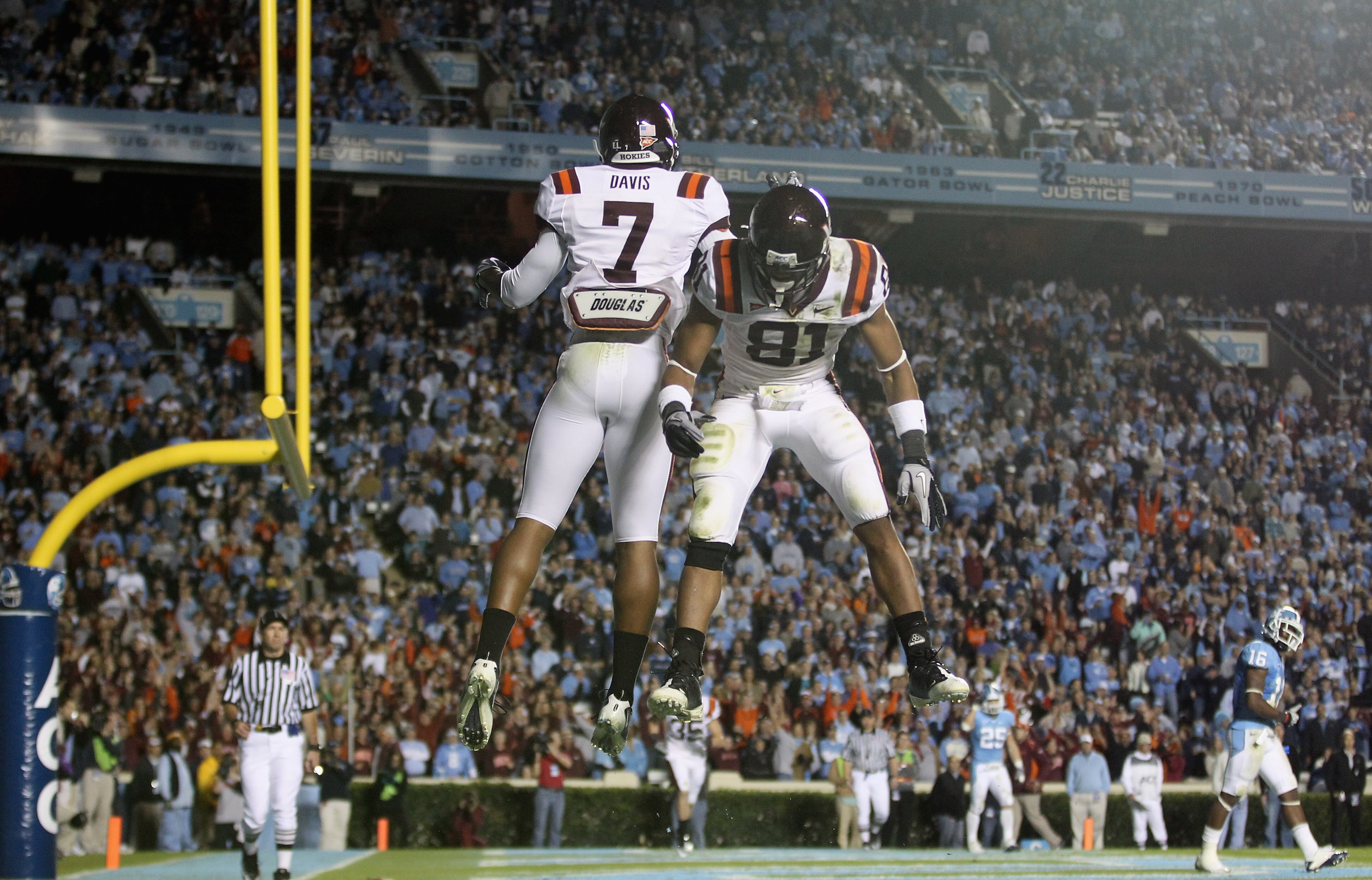 CHAPEL HILL, NC - NOVEMBER 13:  Marcus Davis #7 of the Virginia Tech Hokies celebrates after scoring a touchdown with teammate Jarrett Boykin #81 against the North Carolina Tar Heels during their game at Kenan Stadium on November 13, 2010 in Chapel Hill, 