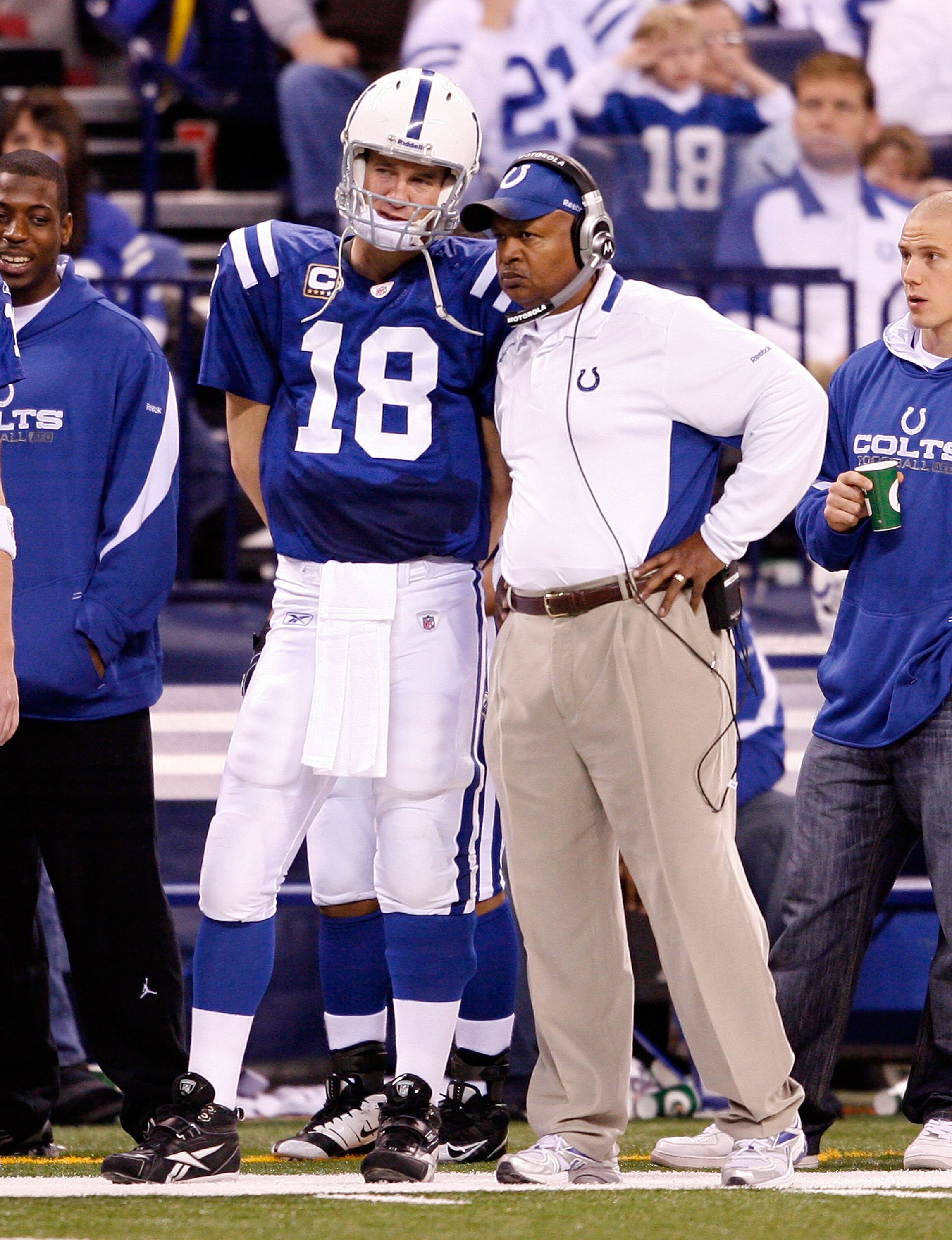 INDIANAPOLIS - DECEMBER 27:  Peyton Manning #18 of the Indianapolis Colts and Head Coach Jim Caldwell are pictured on the sideline during the NFL game against the New York Jets at Lucas Oil Stadium on December 27, 2009 in Indianapolis, Indiana. Manning an