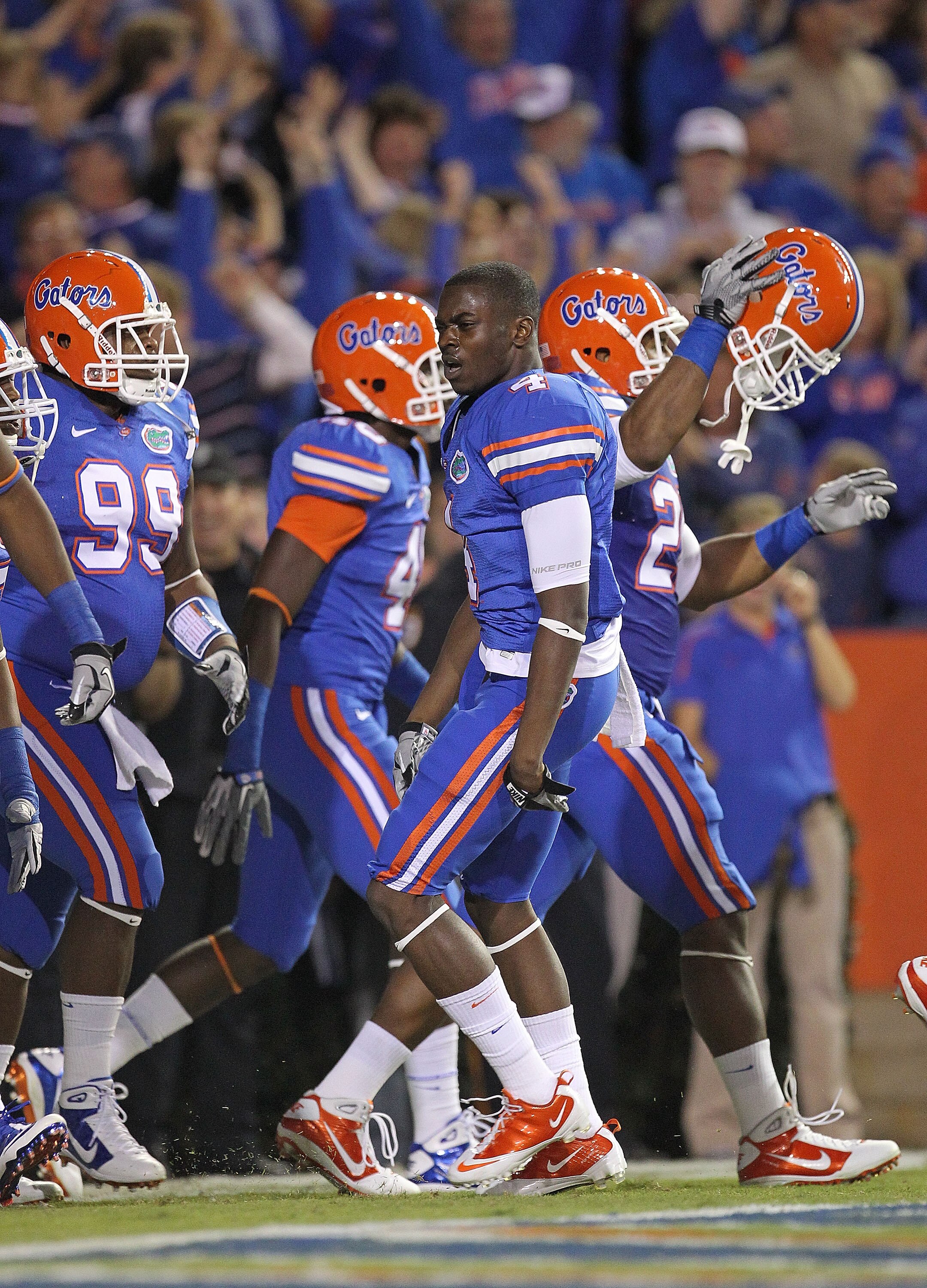 GAINESVILLE, FL - NOVEMBER 13: Andre Debose #4 of the Florida Gators is congratulated after returning the opening kickoff for a touchdown during a game against the South Carolina Gamecocks at Ben Hill Griffin Stadium on November 13, 2010 in Gainesville, F