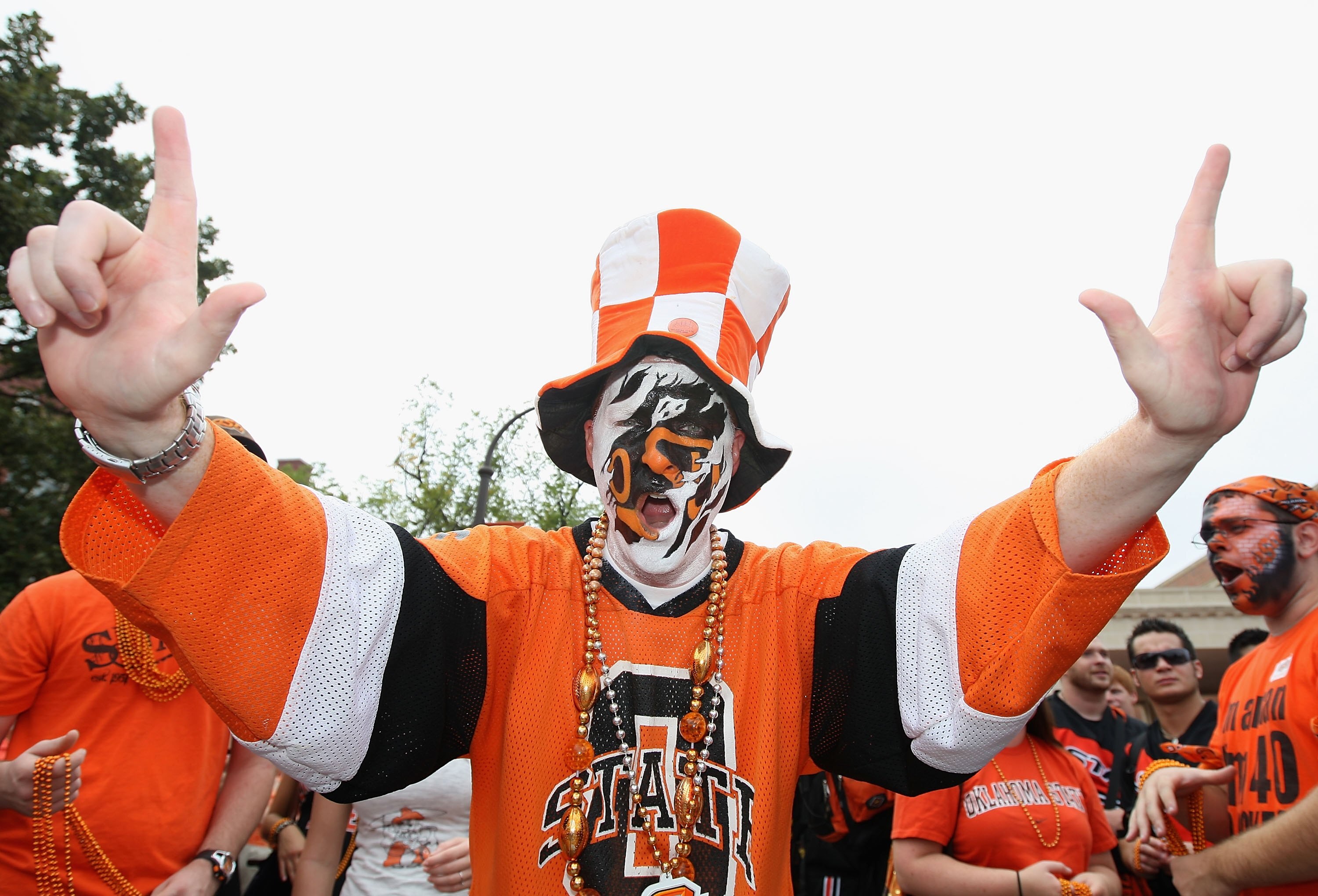 STILLWATER, OK - SEPTEMBER 05:  A fan of the Oklahoma State Cowboys cheers before the college football game against the Georgia Bulldogs at Boone Pickens Stadium on September 5, 2009 in Stillwater, Oklahoma.  The Cowboys defeated the Bulldogs 24-10.  (Pho