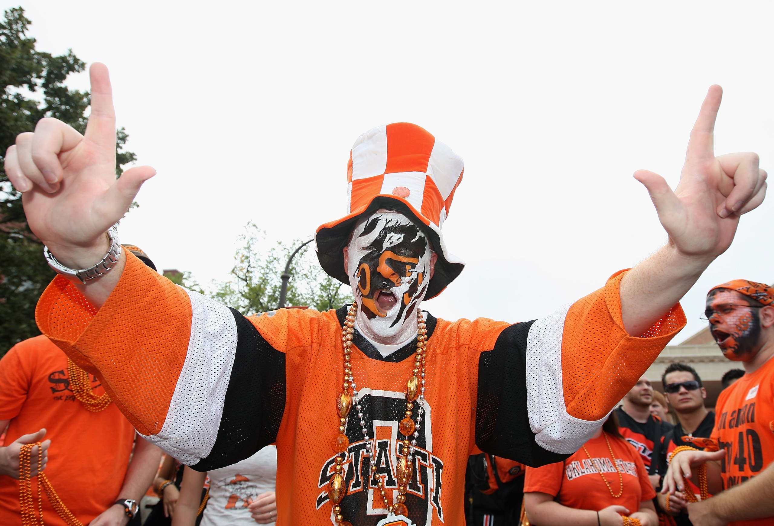 STILLWATER, OK - SEPTEMBER 05:  A fan of the Oklahoma State Cowboys cheers before the college football game against the Georgia Bulldogs at Boone Pickens Stadium on September 5, 2009 in Stillwater, Oklahoma.  The Cowboys defeated the Bulldogs 24-10.  (Pho