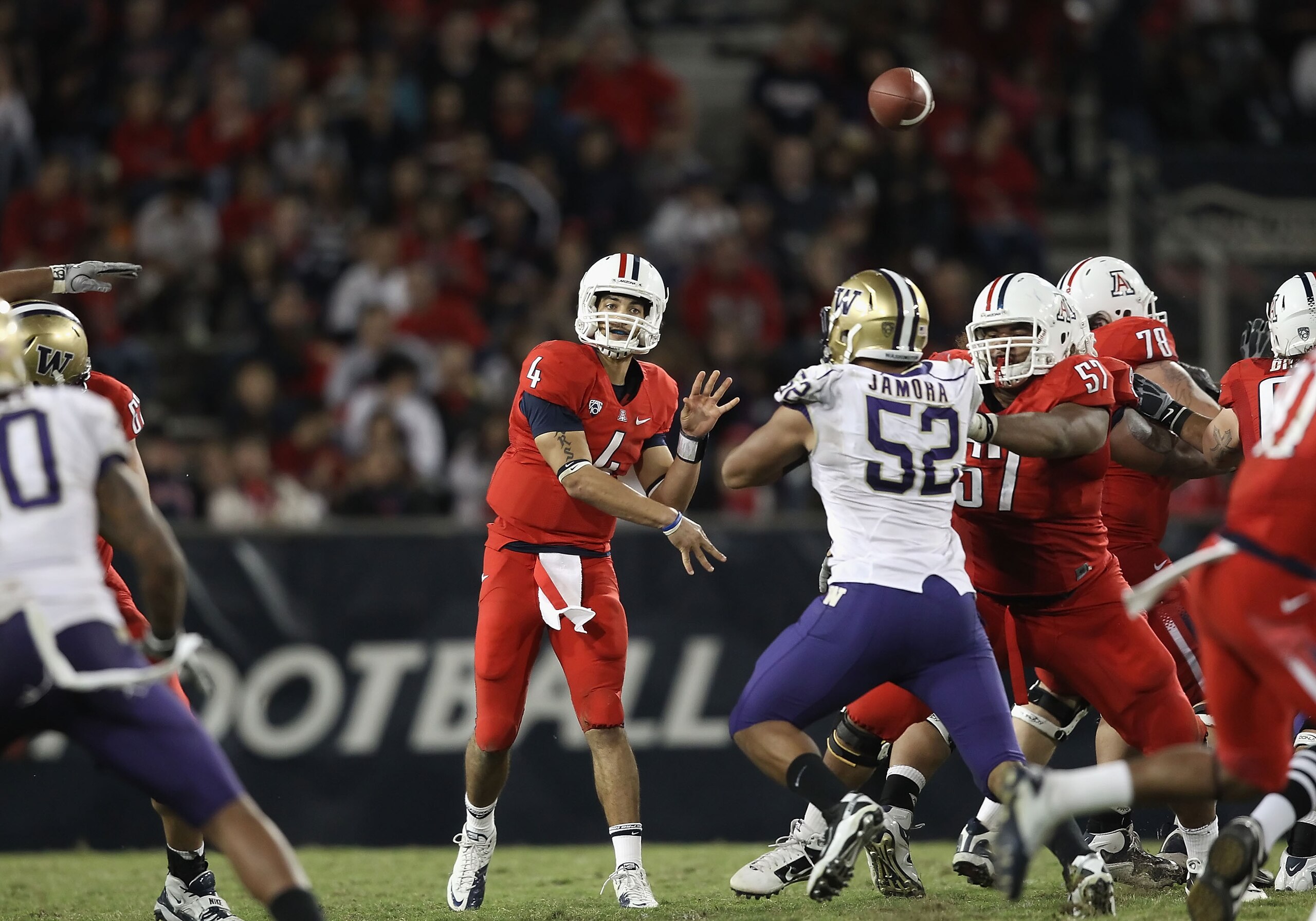 TUCSON, AZ - OCTOBER 23:  Quarterback Matt Scott #4 of the Arizona Wildcats throws a pass during the college football game against the Washington Huskies at Arizona Stadium on October 23, 2010 in Tucson, Arizona.   The Wildcats defeated the Huskies 44-14.